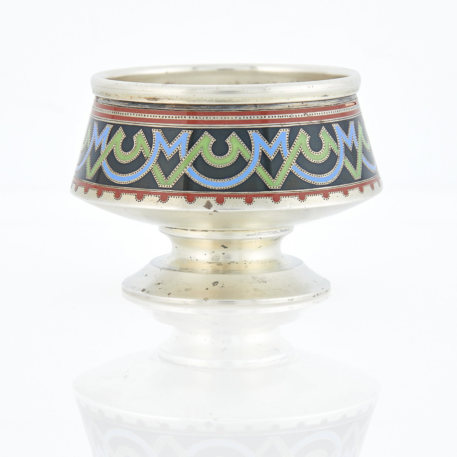 Russian Silver-Gilt and Champlevé Enamel Salt: Grachev, workmaster's mark АП, St. Petersburg, 1899-1903 Tapering cylindrical, the sides enameled with varicolored geometric motifs, on a domed circular foot. Height 1 7/8 inches (4.8 cm).