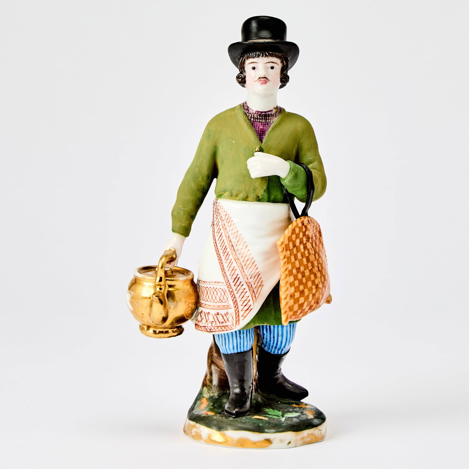 Russian Porcelain Figure of a Sbiten Vendor: Gardner Manufactory, Verbilki, 1820s-1830s Height 7 3/4 inches (19.7 cm). Another version of this model is illustrated in Gardner: XVIII - XIX: Porcelain Plastic Arts from Private Collections & M