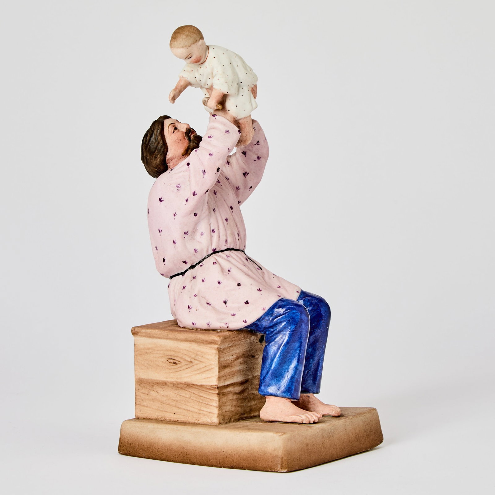 Russian Porcelain Group of a Father and Child: Gardner Manufactory, Verbilki, 1870-1890 Height 9 inches (23 cm).