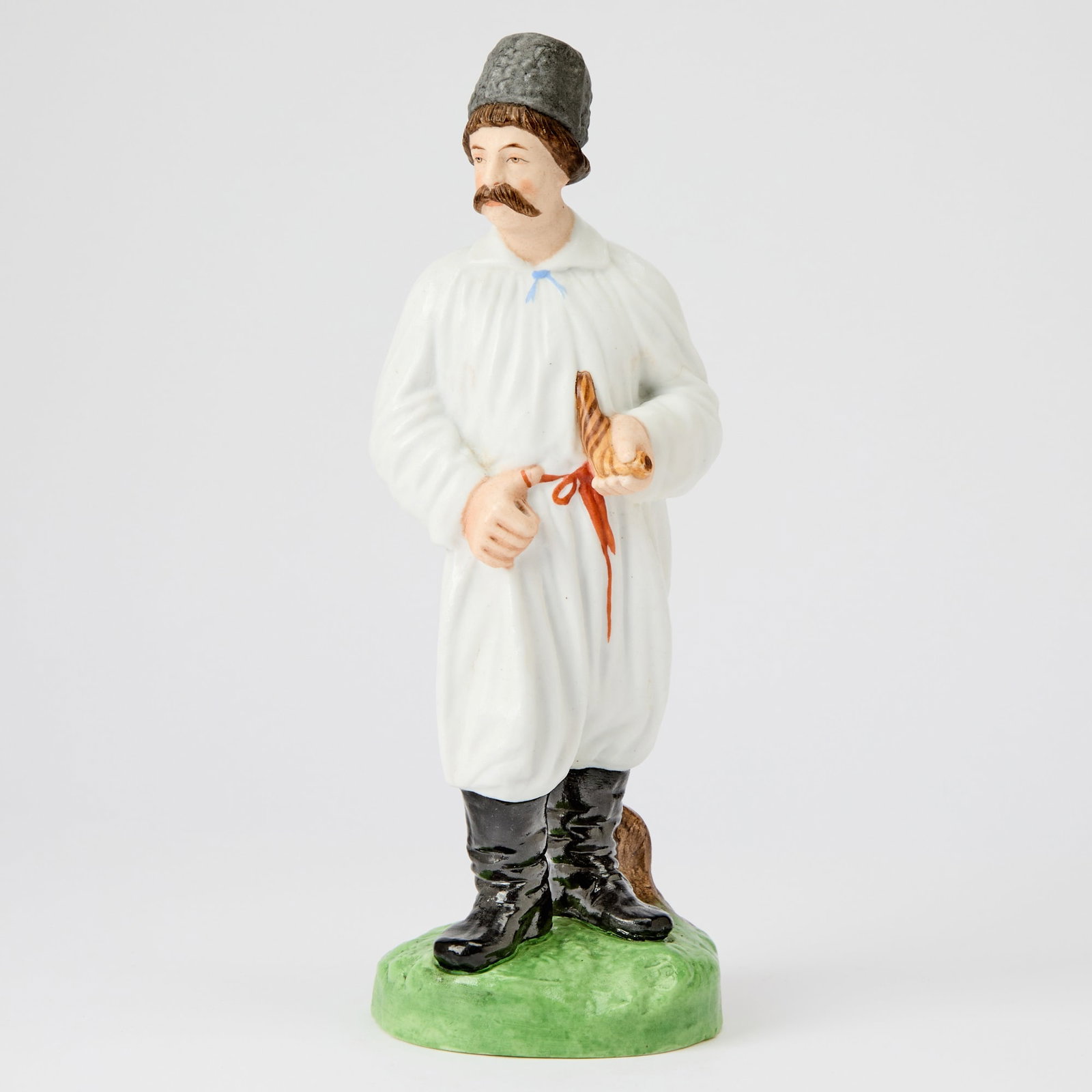 Russian Porcelain Figure of a Ukrainian Man: Gardner Manufactory, Verbilki, 1870-1890 Height 10 1/2 inches (26.7 cm). Another version of this model is illustrated in Gardner: XVIII - XIX: Porcelain Plastic Arts from Private Collections & Mo