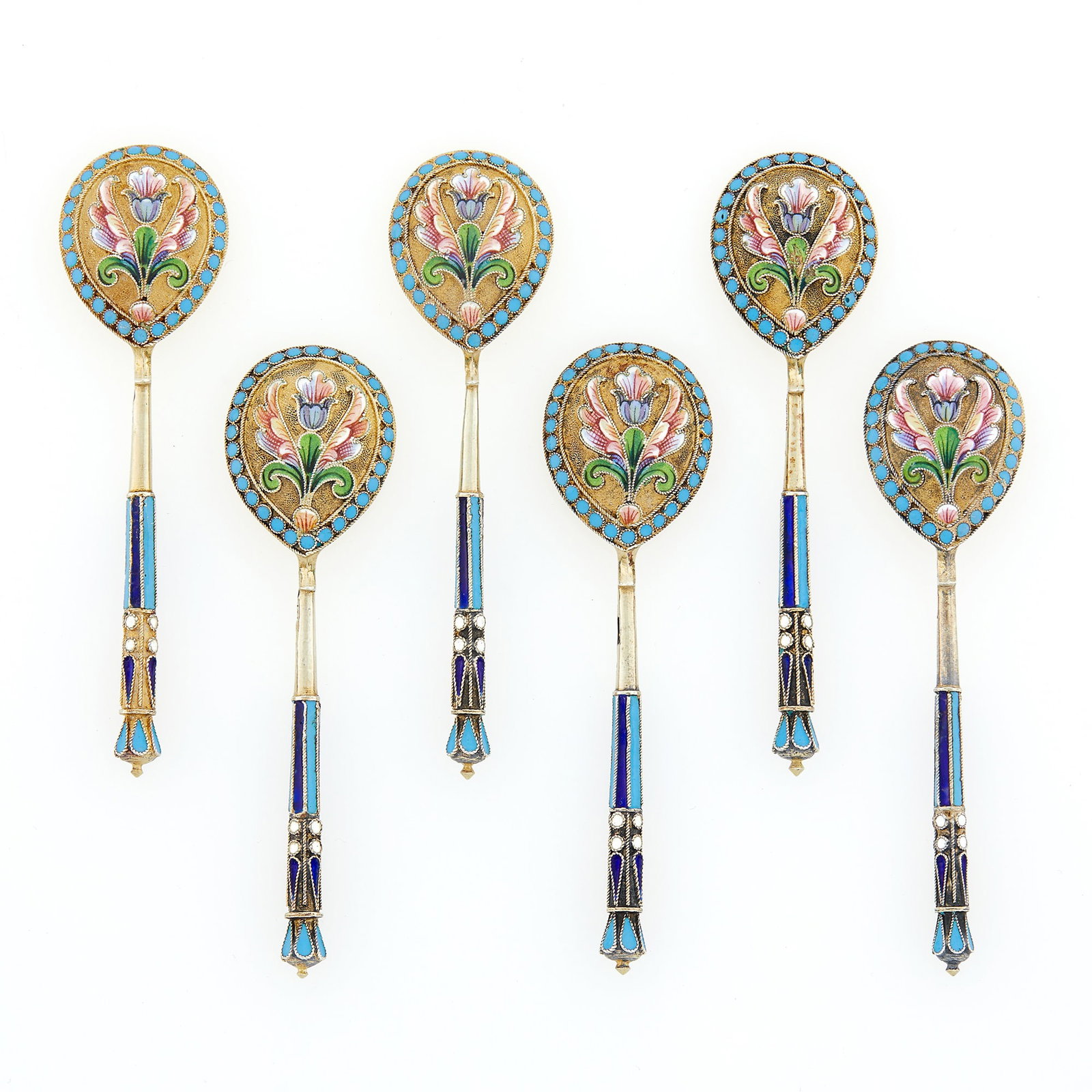 Set of Six Russian Silver-Gilt and Cloisonné Enamel Spoons: Ivan Saltykov, Moscow, 1899-1908 Each with a pear-shaped bowl and faceted stem, the bowl enameled with varicolored shaded flowers and foliage, with a turquoise pellet border. Length 3 1/2 inches (9 cm