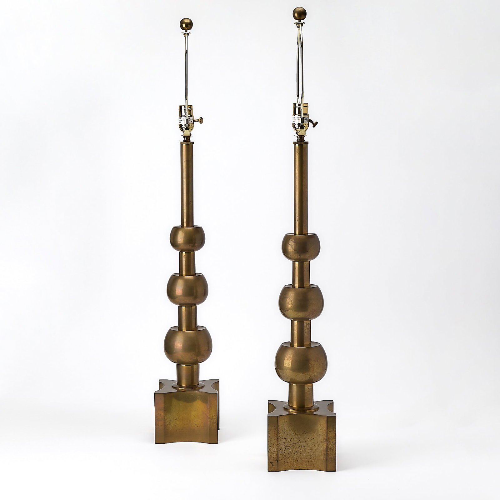 Pair of Tommi Parzinger for Stiffel Patinated Metal Lamps: Mid 20th centuryEach of stacked orb-form, on a shaped square base. Height 26 1/2 inches.