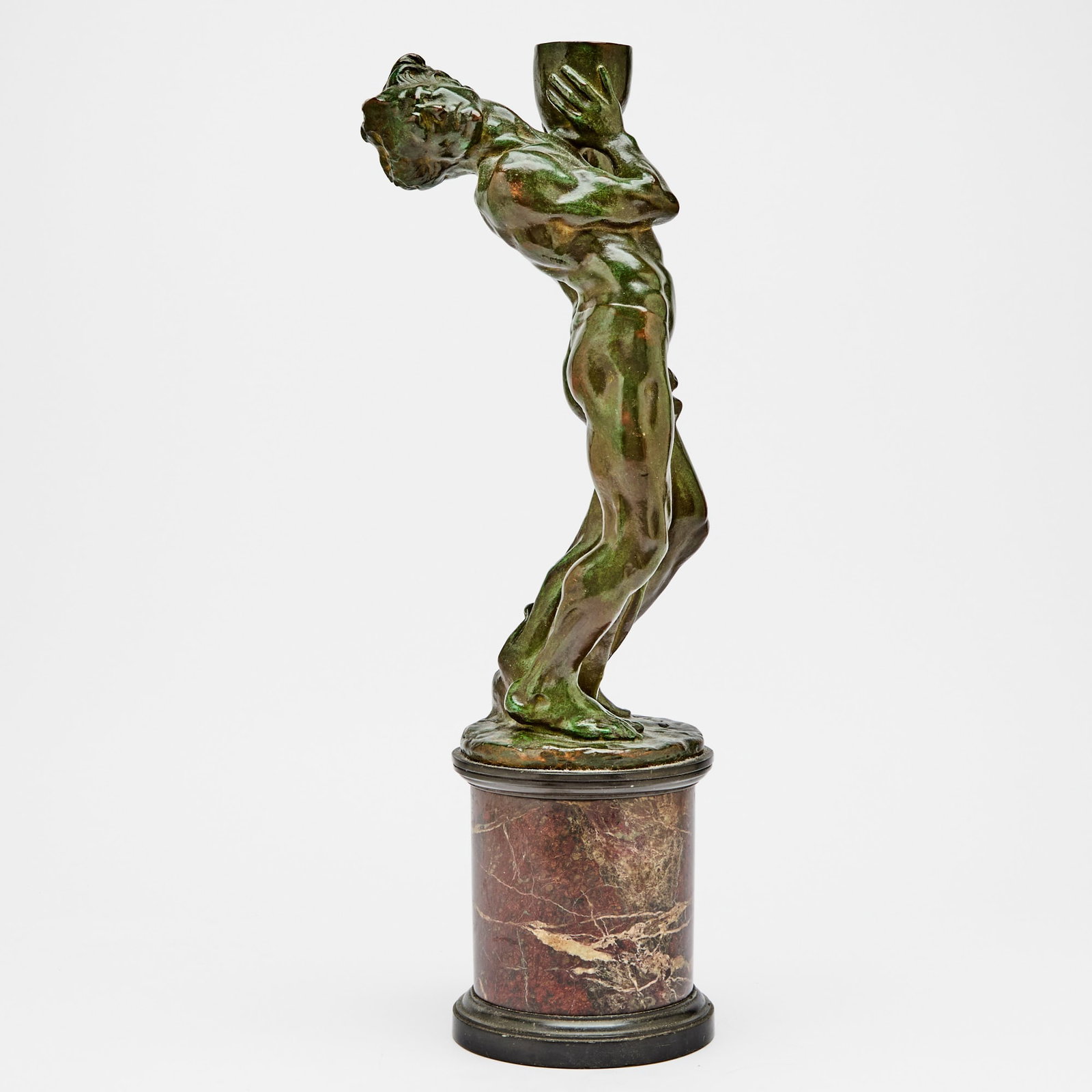 Patinated Bronze Sculpture of Male: After Paul-Ange NocquetDepicting a man holding a vessel. Height 19 inches.