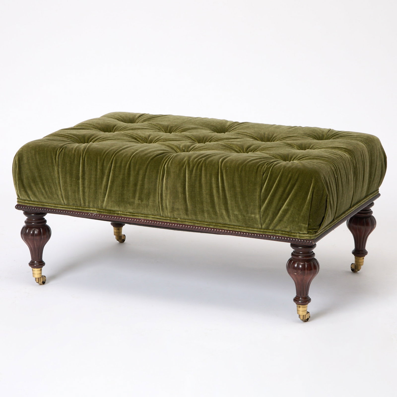 Green Upholstered Mahogany Ottoman: On casters. 