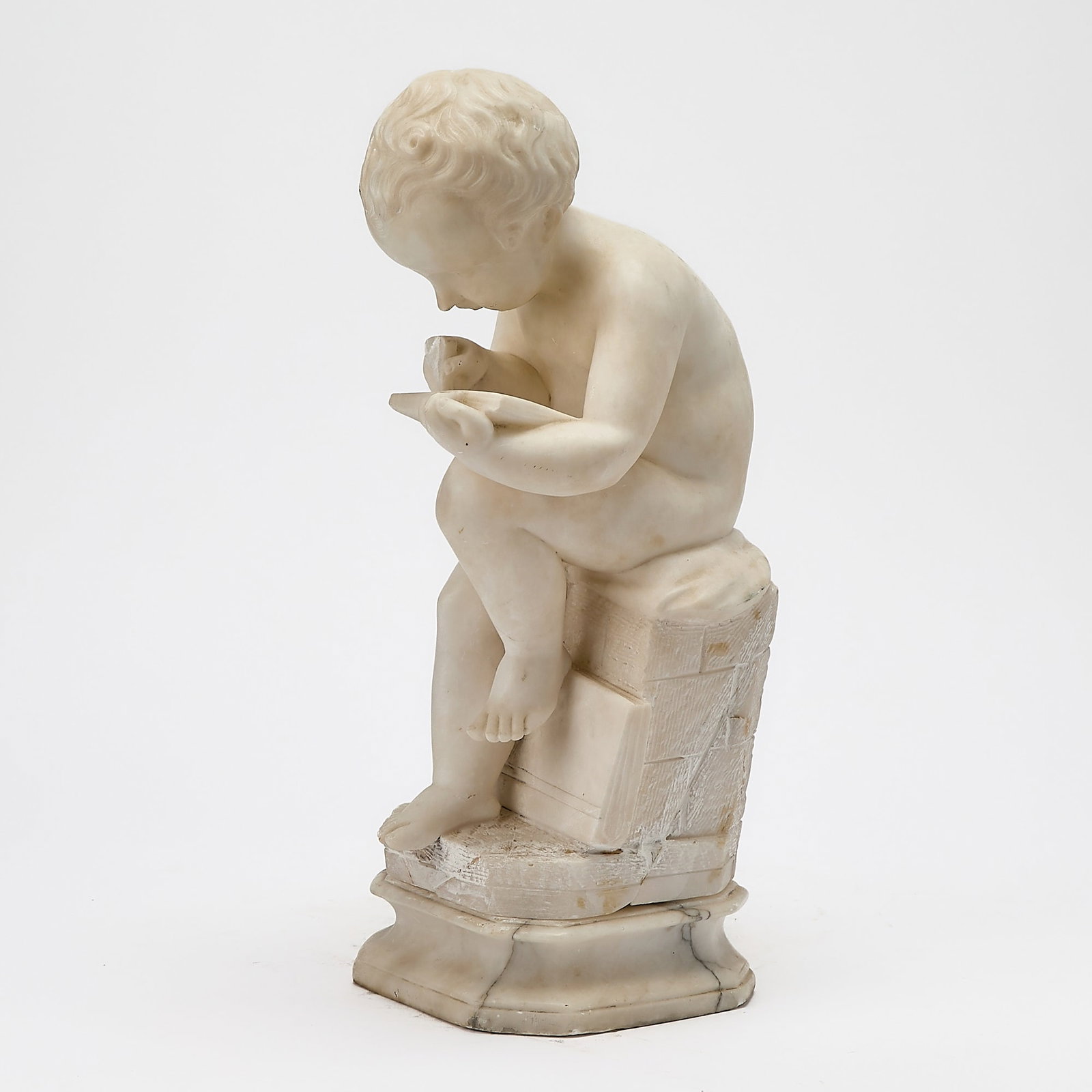 Italian Marble Figure of a Boy Reading: Height 18 1/2 inches.
