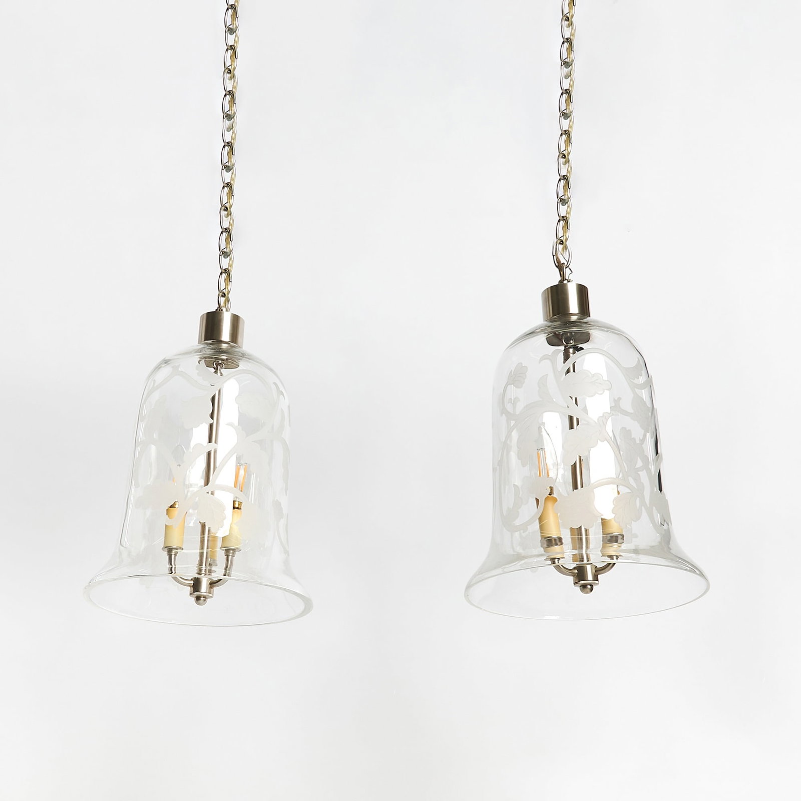 Pair of Glass "Arabesque" Bell Jar Lanterns: Height 15 inches, diameter 10 3/4 inches.