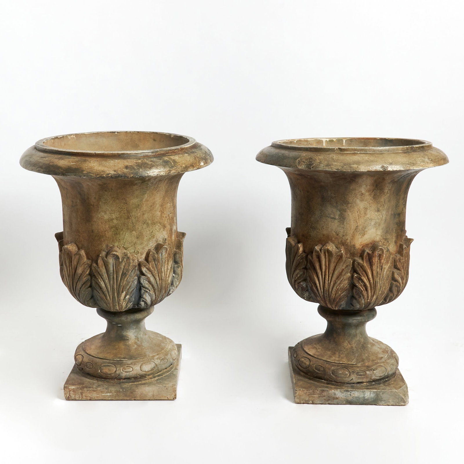 Pair of Large Painted Terracotta Garden Urns: 20th CenturyIn the Doulton of Lambeth style with crisply carved acanthus decoration and carved borders to the bases. Height 30 inches, diameter 22 inches. chips and losses on the edges