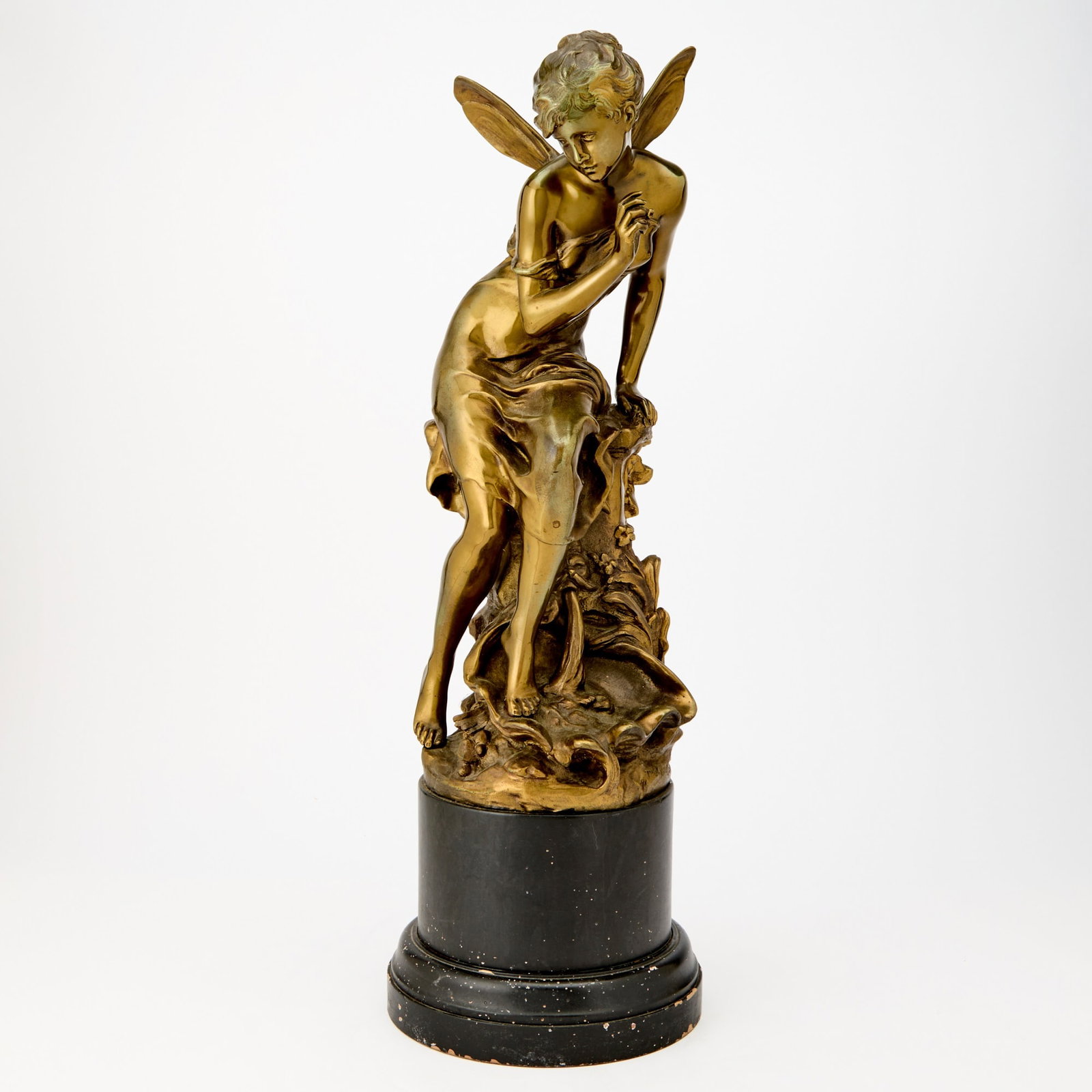Patinated Bronze Figure of a Sprite: Cast after a model by Mathurin MoreauRaised on a black-painted composition base. Height overall 24 inches.