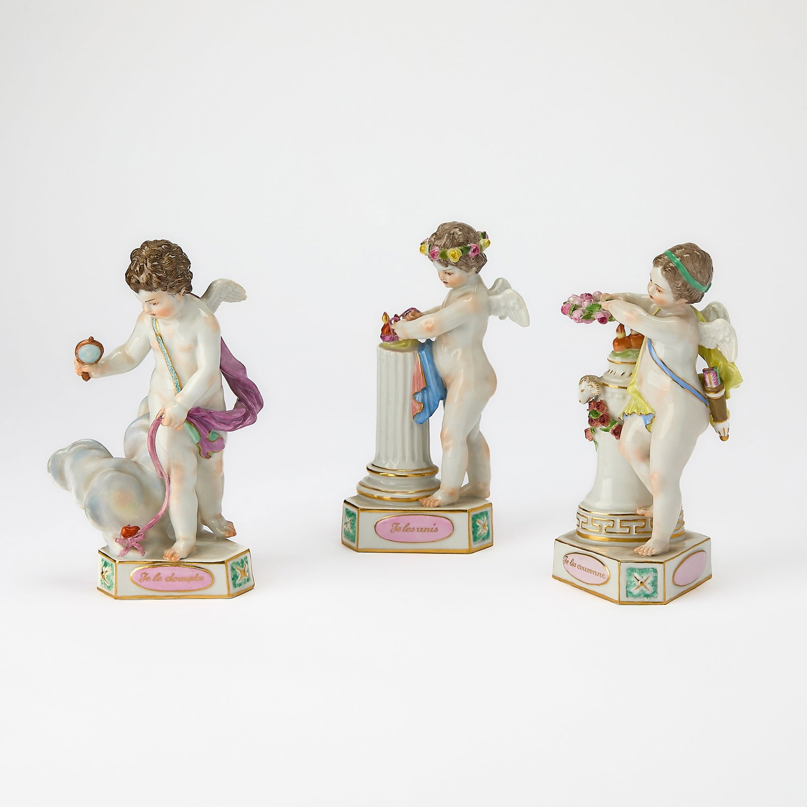 Three Meissen Porcelain Figures of Putti: 20th Century Height of tallest 5 3/4 inches.