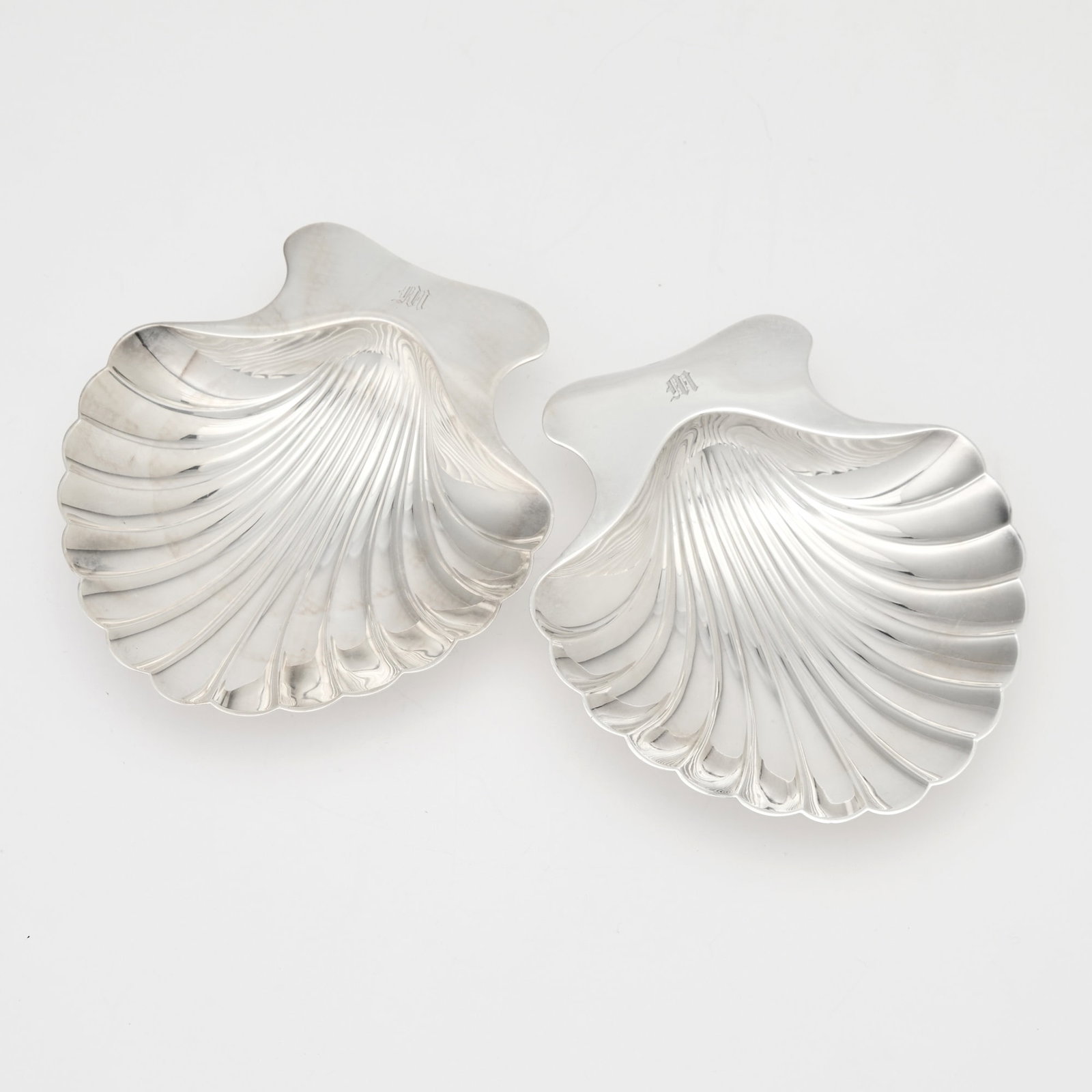 Pair of Tiffany & Co. Sterling Silver Shell Form Dishes: 1907-1938 Length 5 1/4 inches, total approximately 8 ounces.
