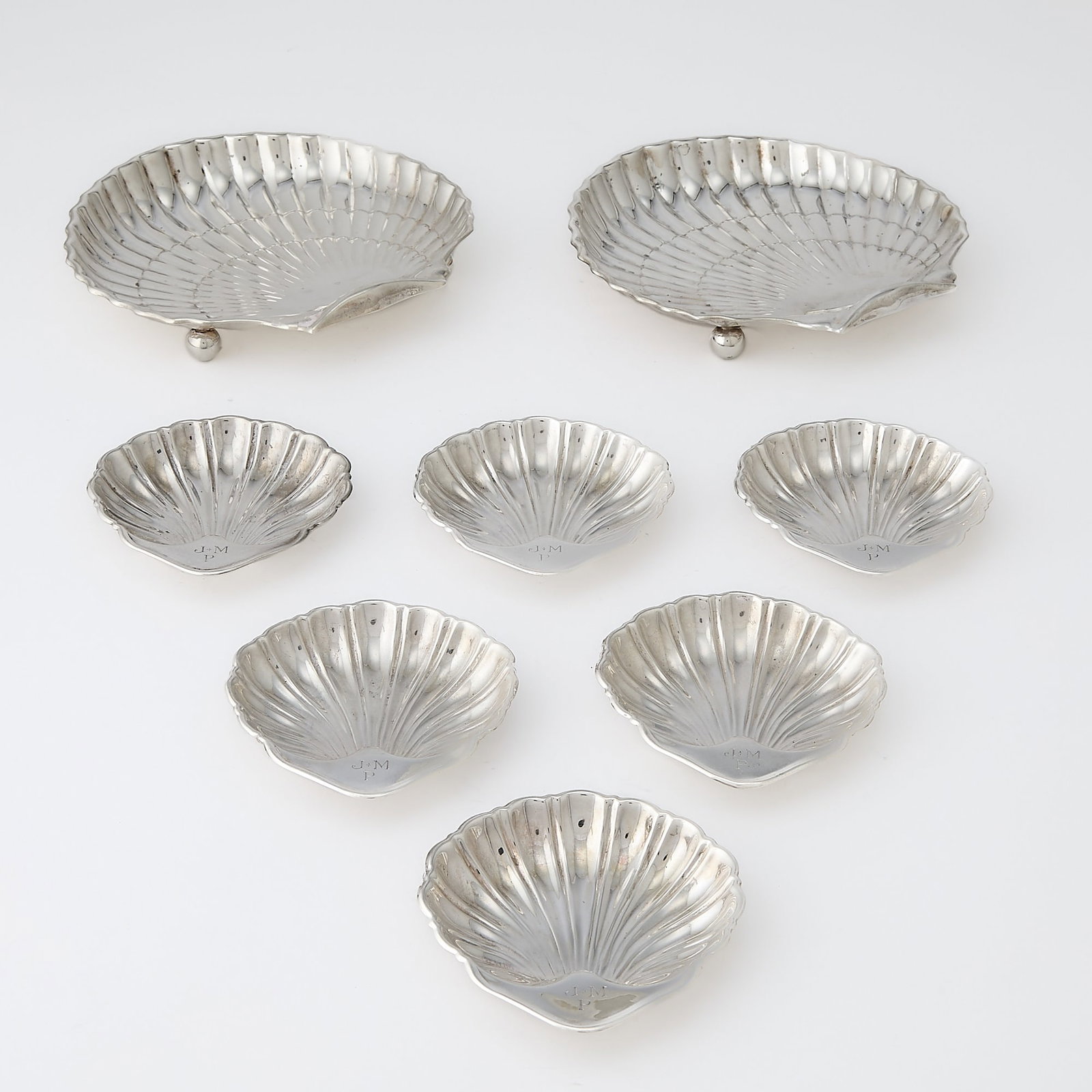 Eight American Sterling Silver Shells: Comprising a pair of larger Gorham examples, length 6 inches; and eight smaller, length 3 1/4 inches, total approximately 14 ounces.