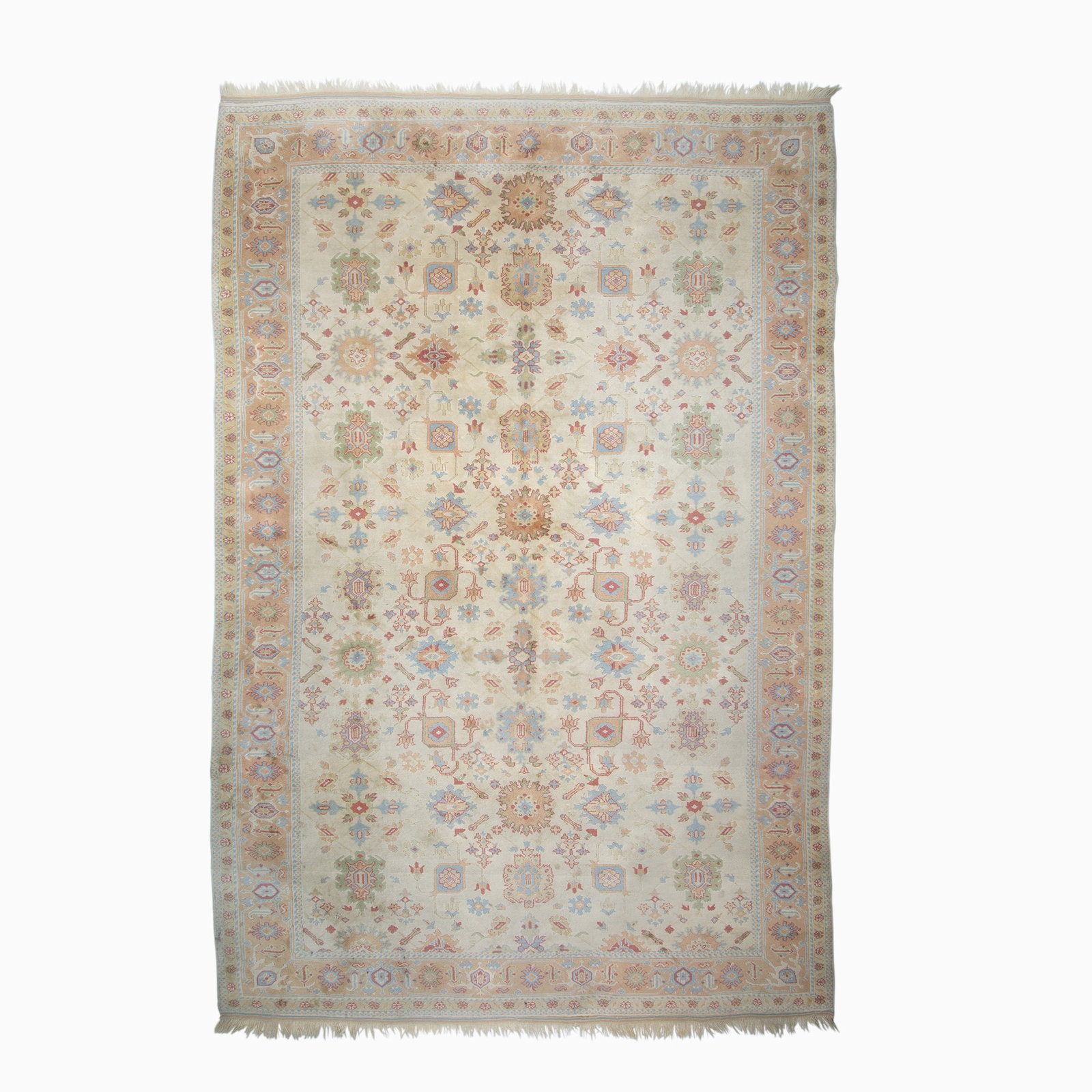 Oushak Carpet: West Turkey, ContemporaryThe ivory field with a polychrome Harshang pattern overall is within a camel palmette and vine border. (16' 10" x 11' 9") Small spot stains, soiled