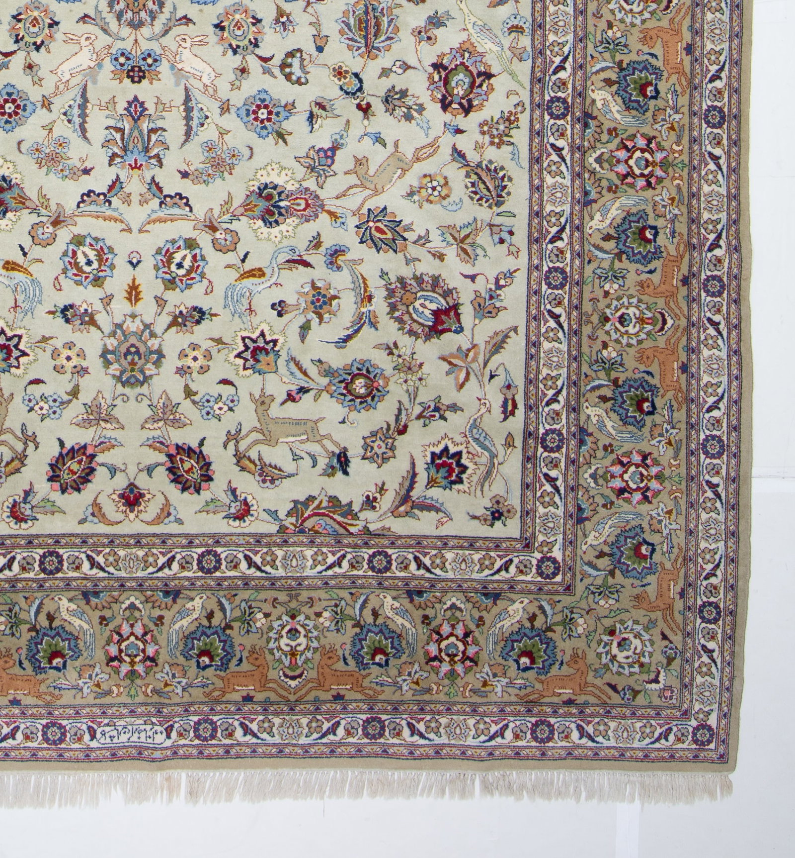 Kashan Carpet: Central Iran, 2nd 1/2 20th CenturyThe overall pattern of animals and birds amongst floral vinery on the slate field is within a taupe palmette border. Signed. (11' 11" x 8' 2") Small spot stains