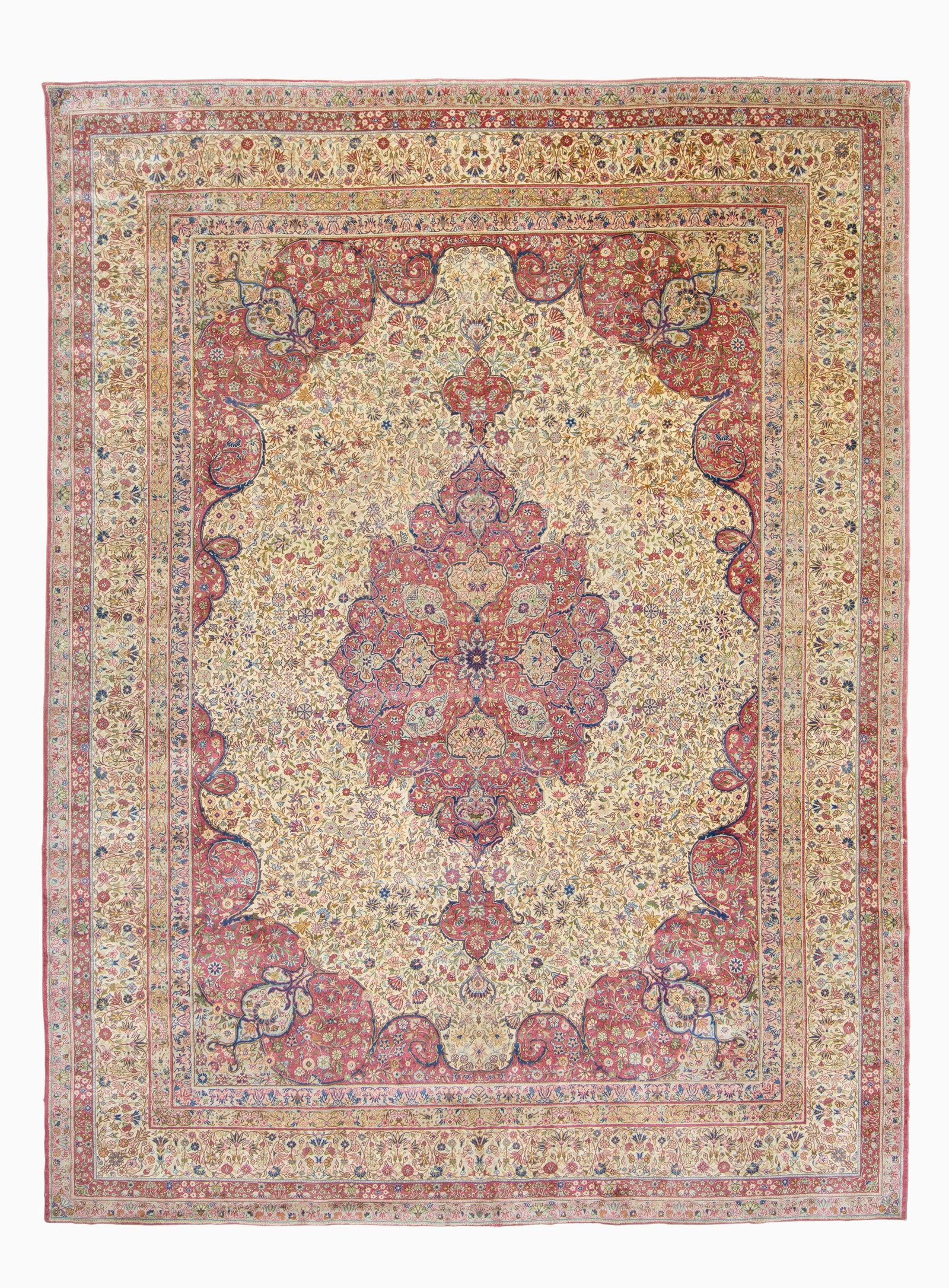 Sivas Carpet: Central Anatolia, First 1/4 20th CenturyThe central pendant medallion on the ivory field flanked by complementary spandrels is within a floral vinery border. (11' 6" x 8' 8") Areas of minor wear,