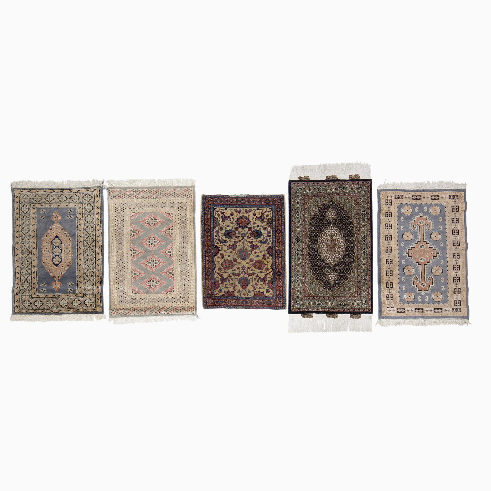 Five Assorted Mats: A Kurkwool and Silk Mahi Tabriz mat (cotton foundation, 256 kpsi), an early 20th century Kerman mat, and three late 20th century Pakistan Bokhara mats. (3' 6" x 2' 1", 2' 10" x 2' 1", 3' 2" x 2' 2", 3