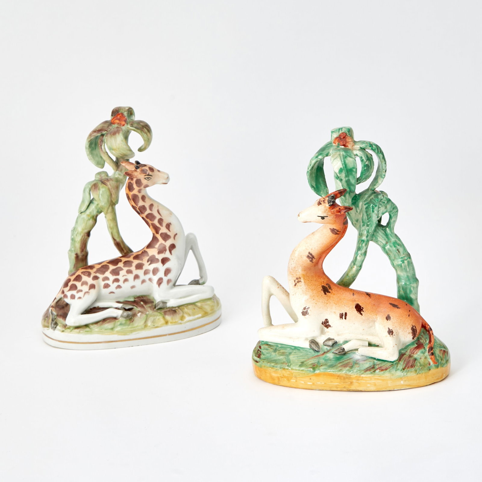 Two Staffordshire Recumbent Giraffes: 19th Century Height of taller 8 1/2 inches.