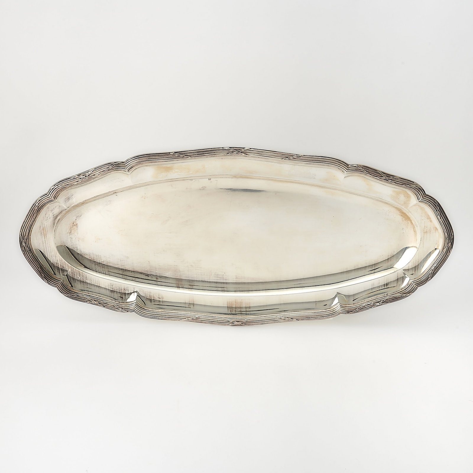 American Sterling Silver Fish Platter: Mid 20th century Shaped oval with tied reeded border. Length 23 1/2 inches, approximately 54 ounces