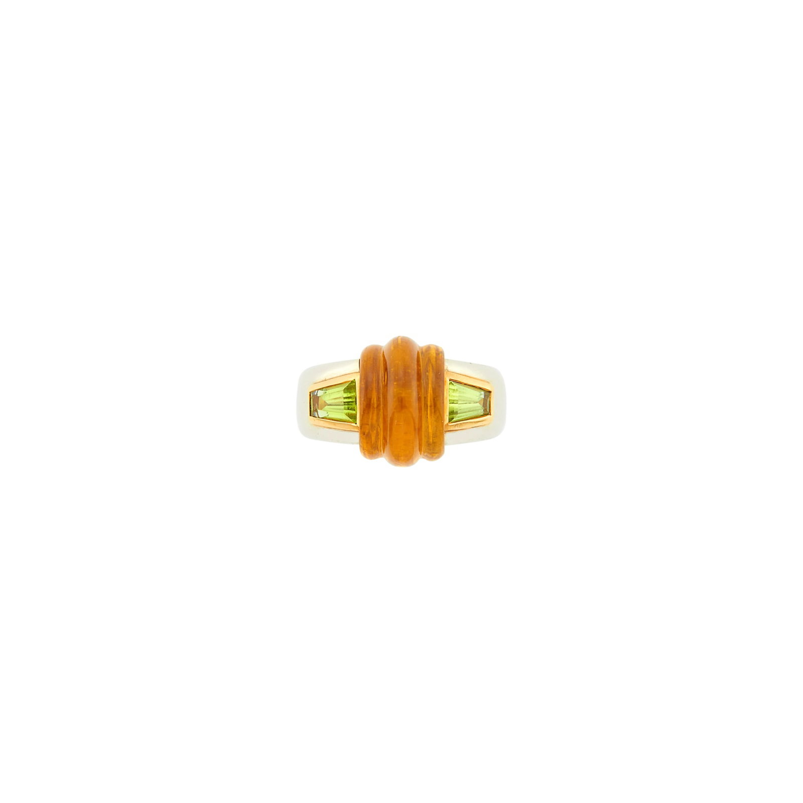 Bulgari Two-Color Gold, Carved Citrine and Peridot Ring: 18 kt. yellow and white gold, one rectangular carved cabochon citrine, two tapered baguette peridots, signed Bulgari, no. BD8784, with Italian assay mark, ap. 6.7 dwts. Size 5 1/2.