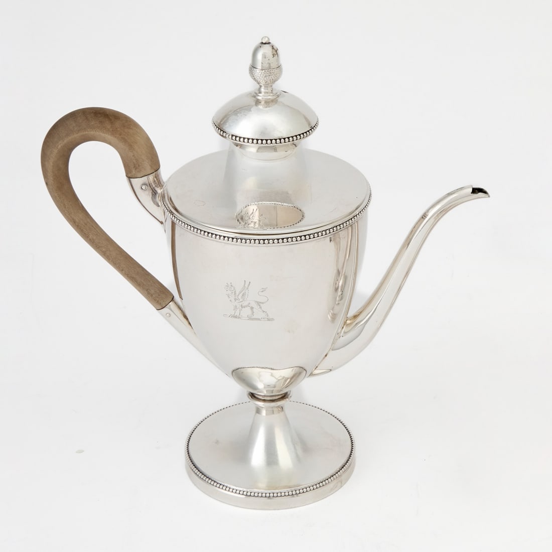 George III Sterling Silver Argyle: John Wakelin & William Taylor, London, 1780s Vasiform with beaded bands and scrolling spout, the removable cover with acorn finial. Height 8 1/2 inches (21.5 cm), approximately 18 ounces.