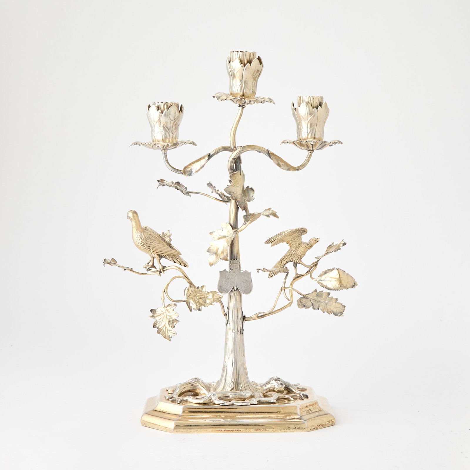 Victorian Sterling Silver Gilt Three Light Figural Candelabra: Charles & George Fox, London, 1854 Formed as a foliate branch issuing three lights and with two birds, all on a rectangular base with canted corners. Height 14 1/4 inches (36 cm), width 9 3/4 inch