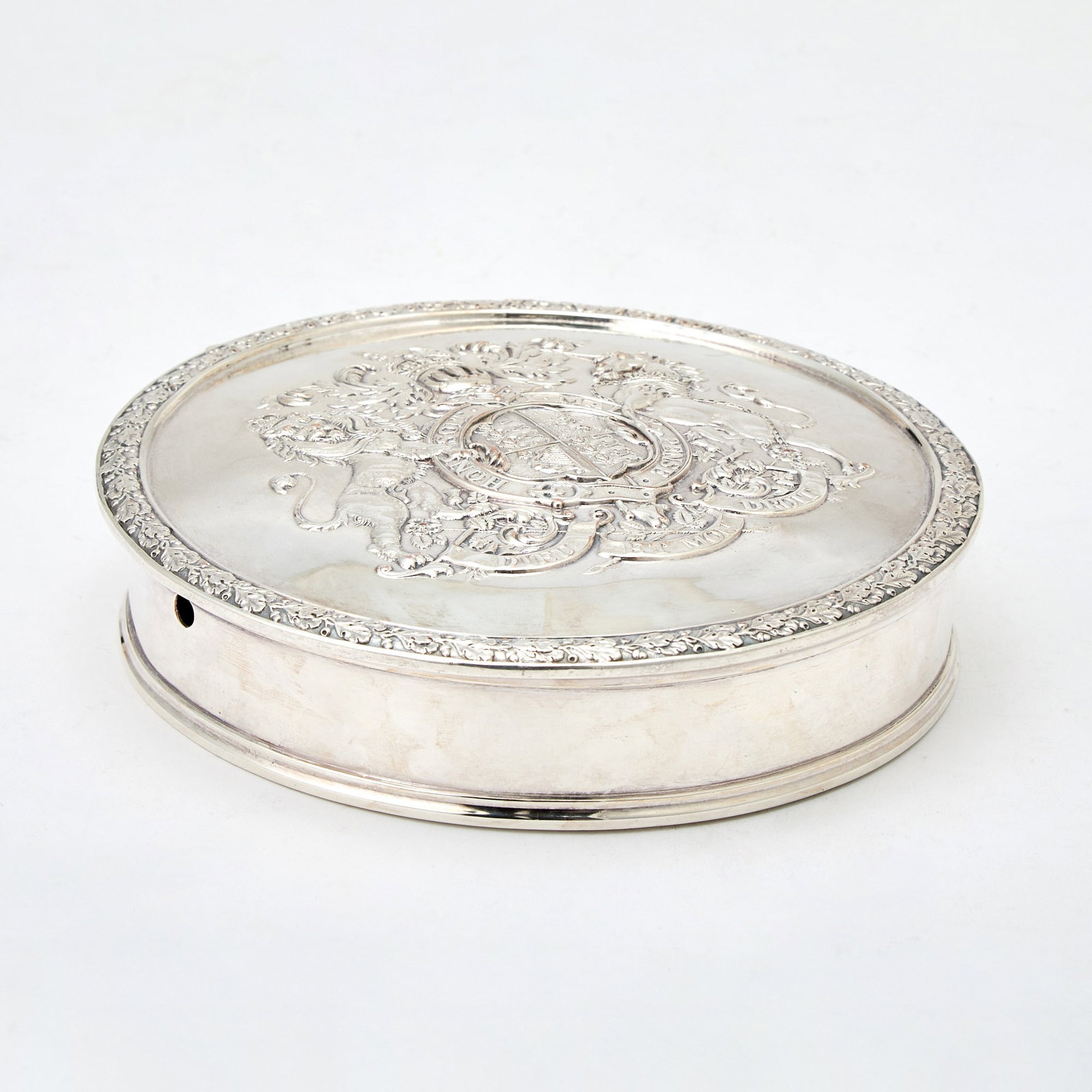 Edward VII Silver Plated Seal Box: R. & S. Garrard & Co., London, early 20th century Circular, the hinged cover chased with the Royal arms of King Edward VII, with oak leaf border. Height 1 1/2 inches (4 cm), diameter 7 1/4 inc