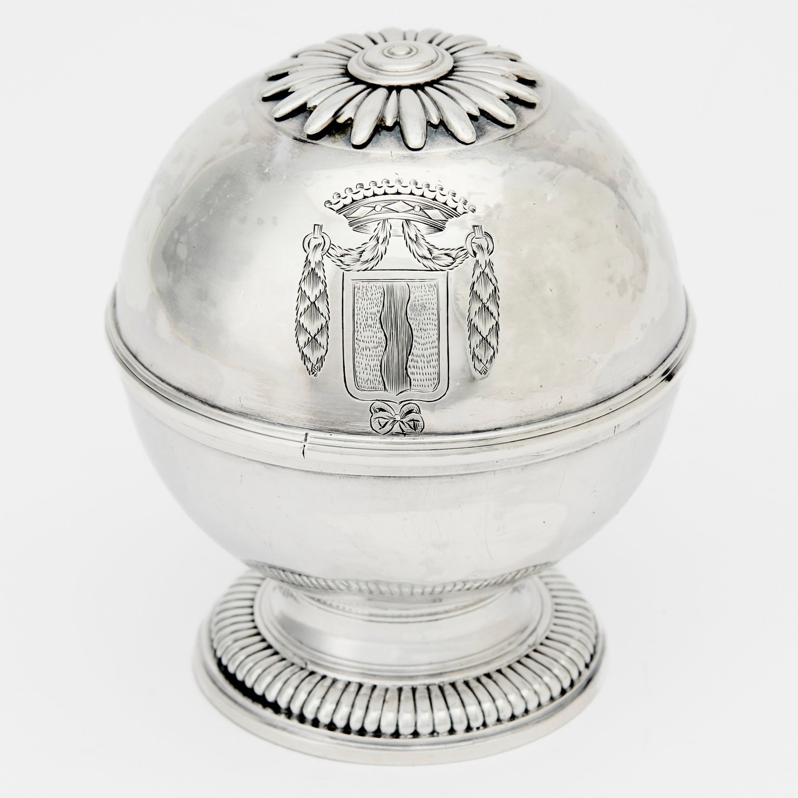 French Louis XVI Silver Soap Box: Late 18th century Globular, the hinged cover with engraved arms, on a straight gadrooned foot. Height 4 inches (10 cm), diameter 3 3/8 inches (8.5 cm), approximately 8 ounces.