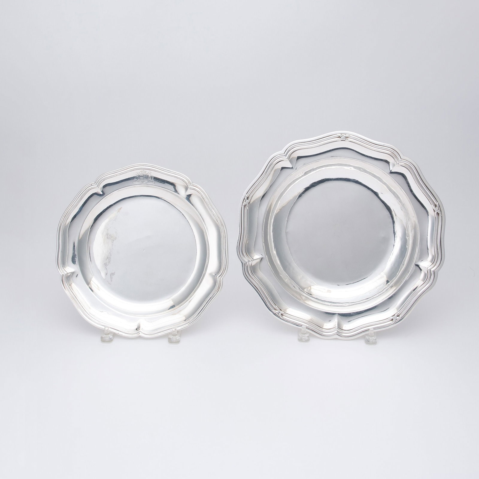 Two French Silver Dishes: 18th/19th Century Each shaped circular, the larger with a tied reeded border. Diameters 13 inches (33 cm), and 10 3/4 inches (27.5 cm), total approximately 52 ounces.