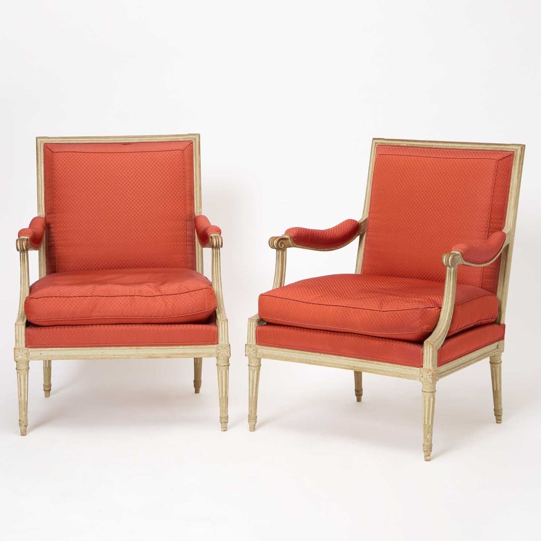 Pair of Louis XVI Painted and Carved Wood Fauteuils à la Reine: Stamped Jean-Baptiste Lebas, Circa 1775 Each with rectangular back and padded arms, supported by scrolled arm supports terminating in carved volutes, the deep seats with loose cushion; on fluted taper
