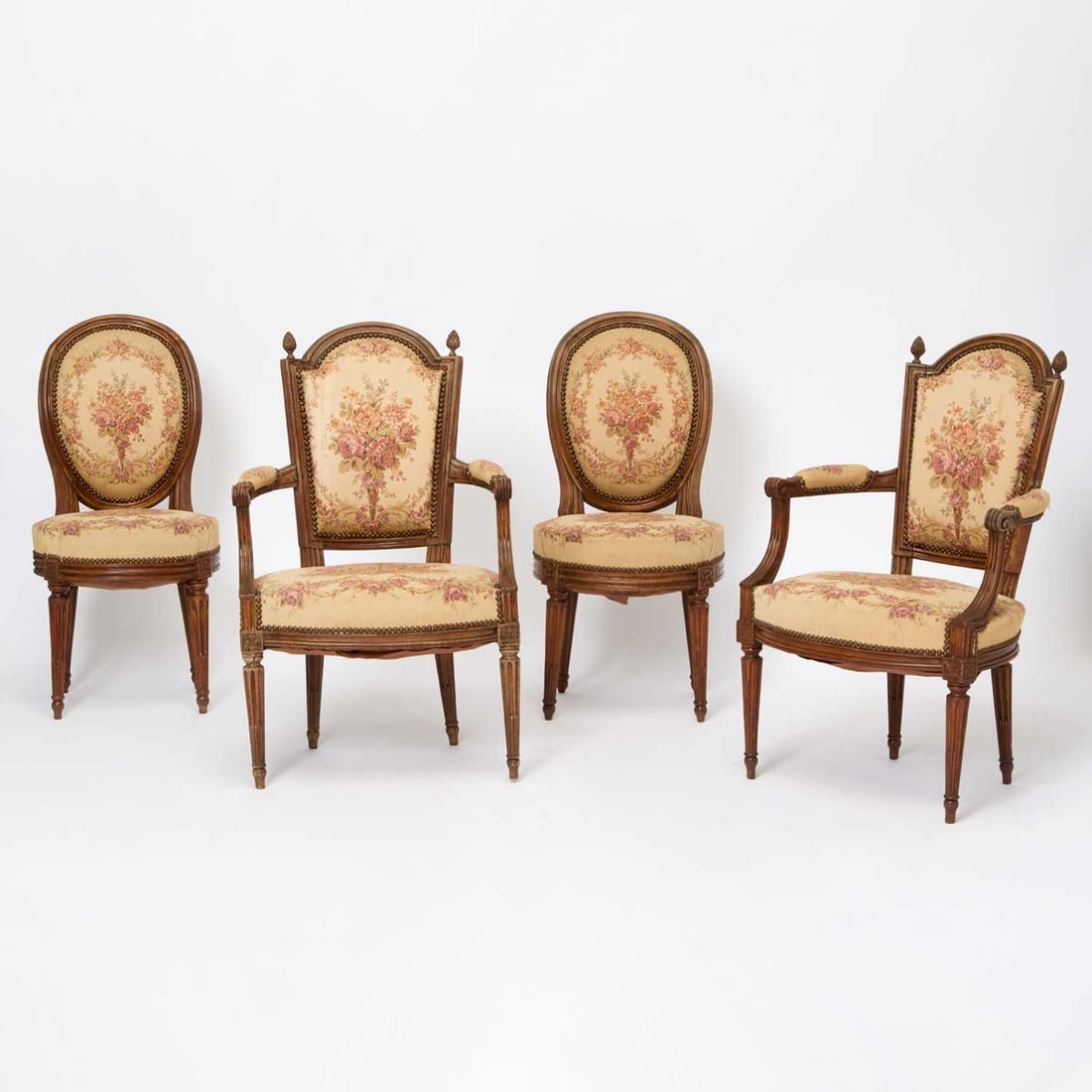 Assembled Set of Four Louis XVI Beechwood and Walnut Fauteuils: Late 18th century One stamped A. Gailliard Height 35 1/4 inches (89.5 cm), width 23 1/2 inches (59.6 cm), depth 17 inches (43.1 cm) Antoine Gaillard reçu maître in 1781 Footnote:<