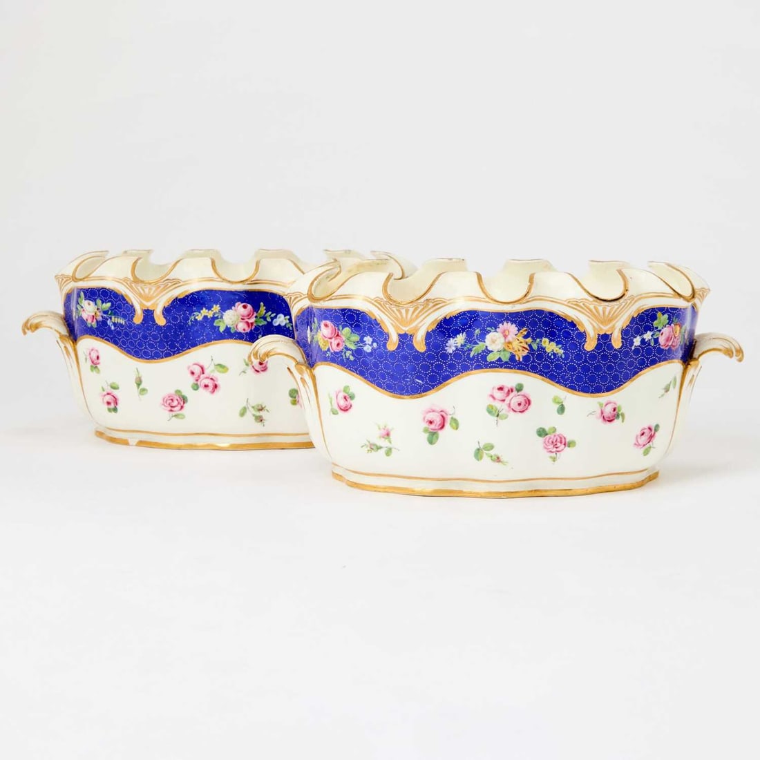 Pair of Sèvres Porcelain Verrières: The porcelain 18th century, the decoration 19th century Interlaced L's flanked by S and Y Height 4 3/4 inches (12 cm), width 11 1/2 inches (29.3 cm), depth 8 inches ( 20.5 cm). One of this pair o