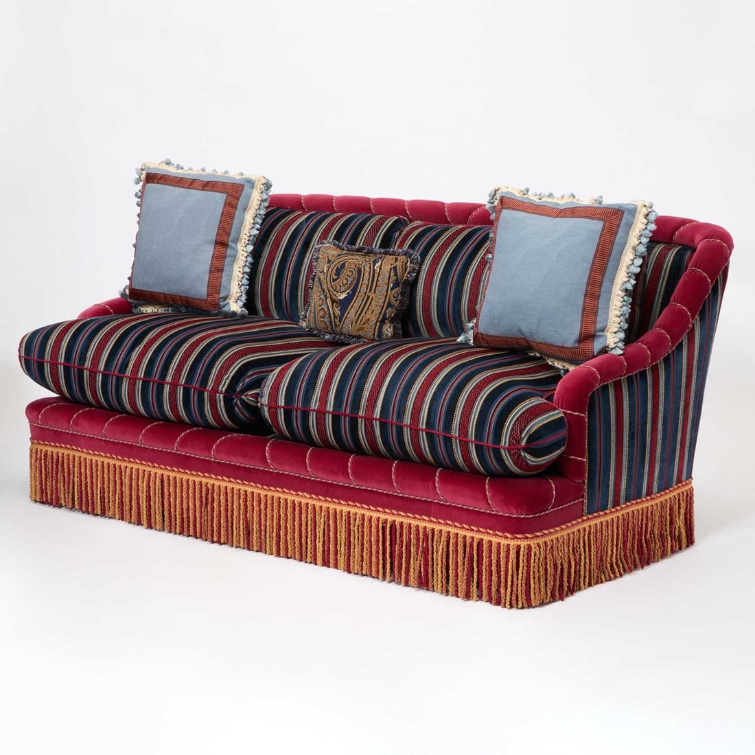 Lee Jofa Red and Blue Velvet Upholstered Two-Seat Sofa: American, late 20th Century, early 21st Century The arched padded back with outscrolled and padded arms, upholstered in a striped velvet fabric of burgundy, navy and cream tones. Together with three p