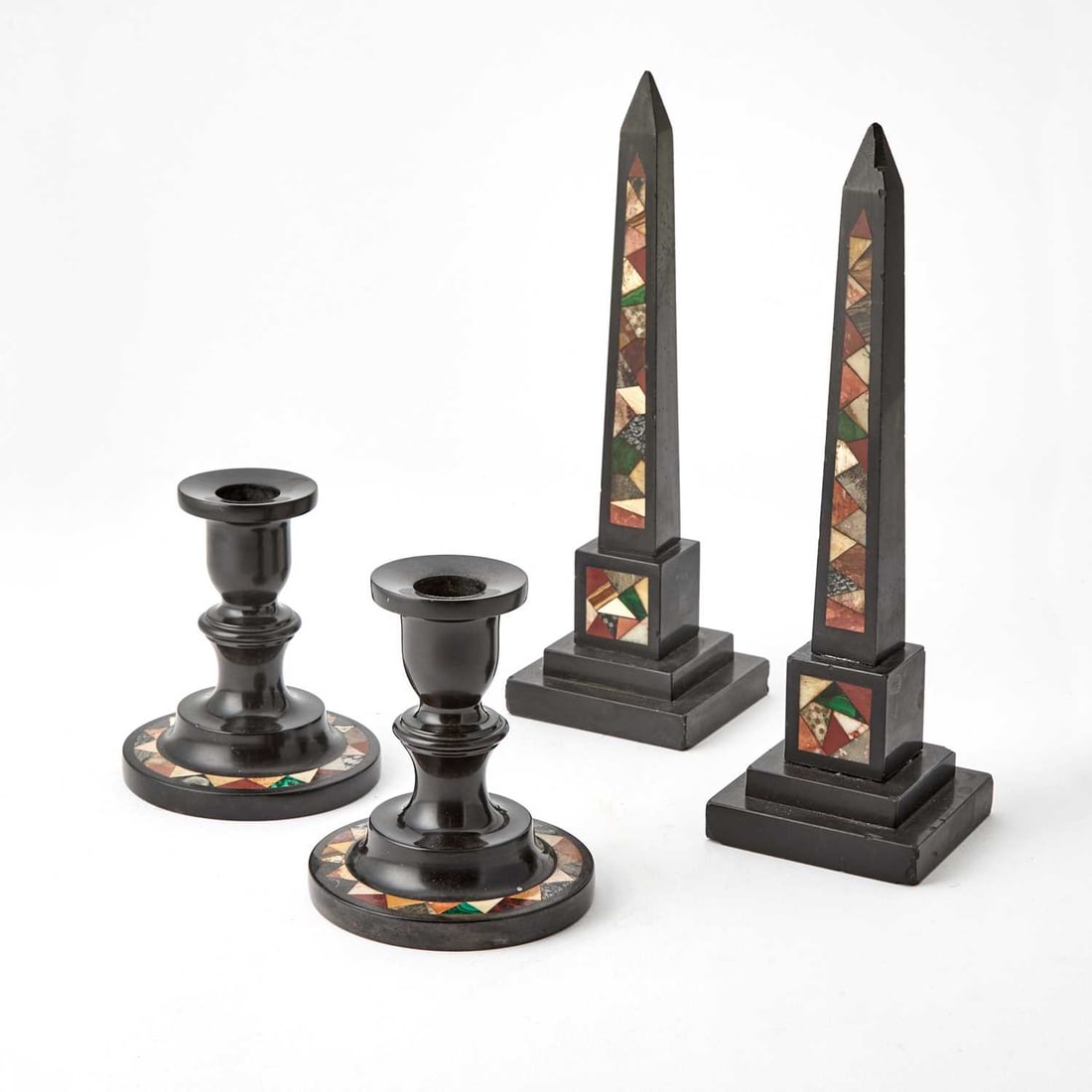 Pair of English Specimen Marble Obelisks: Together with a pair of specimen marble candle holders, second half 19th century Height 10 inches (25.4 cm), 4 1/2 inches (11.5 cm). Some damage at the base of the obelisks.