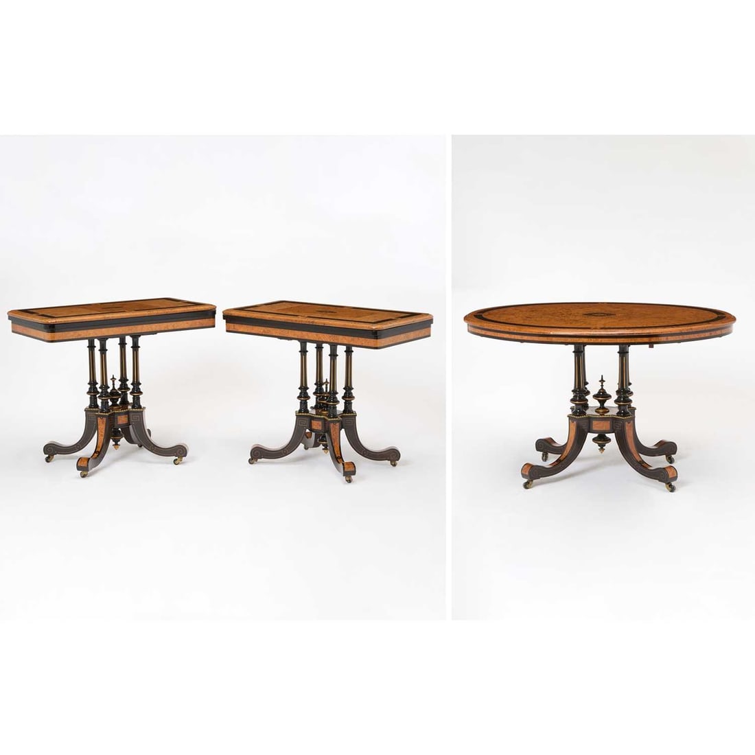 Pair of Victorian Gilt-Bronze Mounted Amboyna and Ebonized Card Tables Together with a Matching: Circa 1870 Pair height 28 3/4 inches (73 cm), width 34 1/4 inches (87 cm), depth 19 inches (48 cm); oval center table height 29 1/2 inches (75 cm), width 47 1/2 inches (120 cm), depth 34 1/2 inches (8