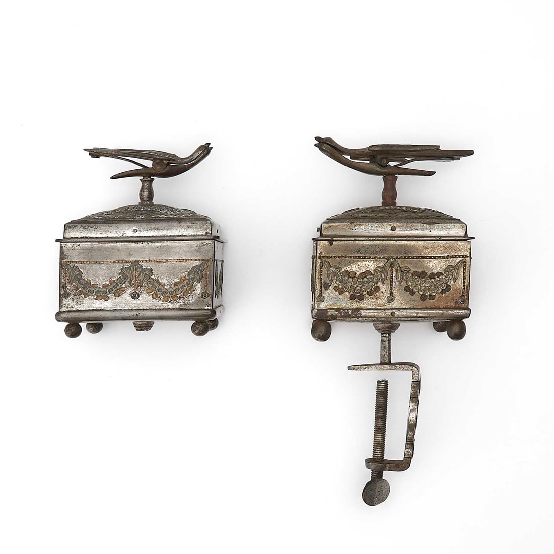 Two Russian Parcel-Gilt Tula Steel Sewing Boxes and Covers: One by T.I. Svechnin, Tula, Mid-19th Century The rectangular bodies molded with festoons of floral garlands, the covers surmounted by a stylized bird-form finial, the interiors fitted for sewing imple