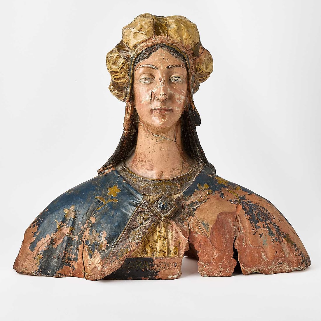 Italian Terracotta Female Bust: 18th century With traces of polychromy Height 21 inches (53.5 cm), width 25 inches (63.5 cm), depth 10 inches (25.5 cm). Overall restored and with losses.