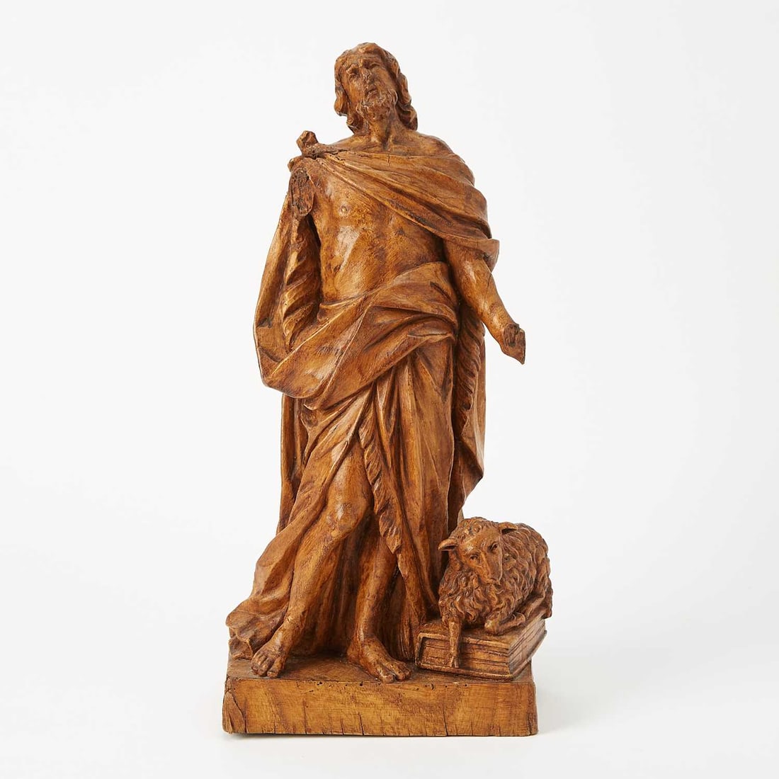 Continental Carved Walnut Figure of Saint John the Baptist: Late 19th/early 20th century Height 15 inches (38.1 cm), width 7 inches (17.7 cm), depth 4 inches (10.1 cm).