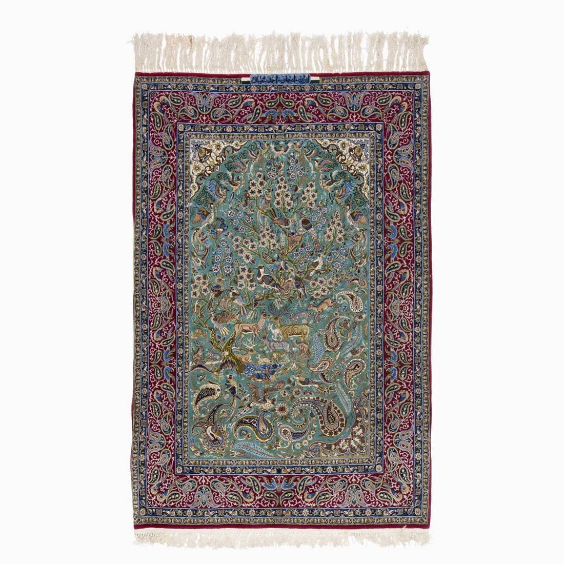 Silk Warp Isfahan Prayer Rug: Central Iran, 2nd 1/2 20th Century The ascending pattern of animals and birds on the jade field beneath ivory spandrels is within a crimson boteh border. Signed Ahmad Shahabi. Silk highlights. Approxi