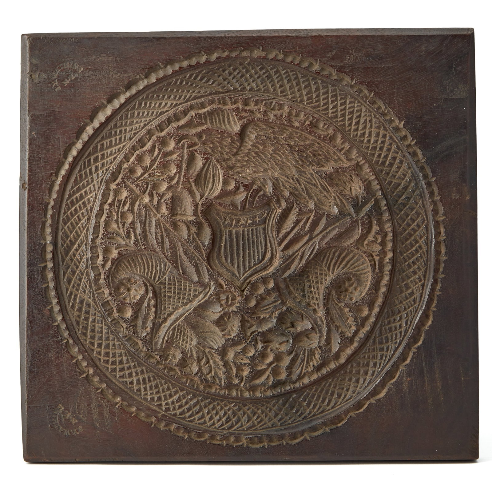 Carved Patriotic Mahogany Cake Board: J.Y. Watkins, New York, second quarter 19th century Centering an American eagle, stamped four times by the maker. Height 10 1/2 inches, width 11 3/4 inches.