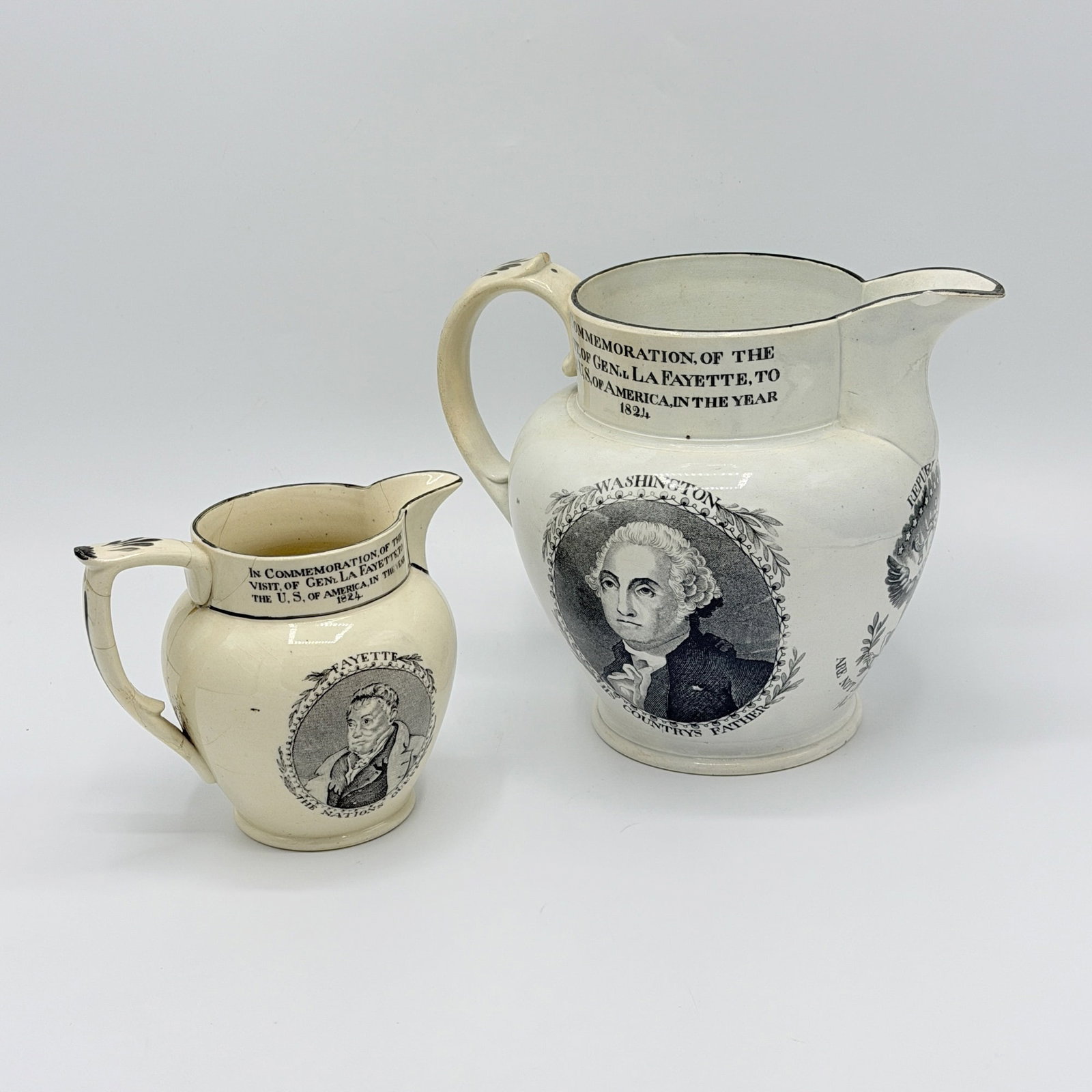Two Transfer Decorated Washington & Lafayette Commemorative Creamware Pitchers: England, circa 1824 Each with a portrait of the two generals and an eagle clutching arrows and an olive branch below thirteen stars, inscribed in part ?IN COMMEMORATION OF THE VISIT, OF GEN.L LA