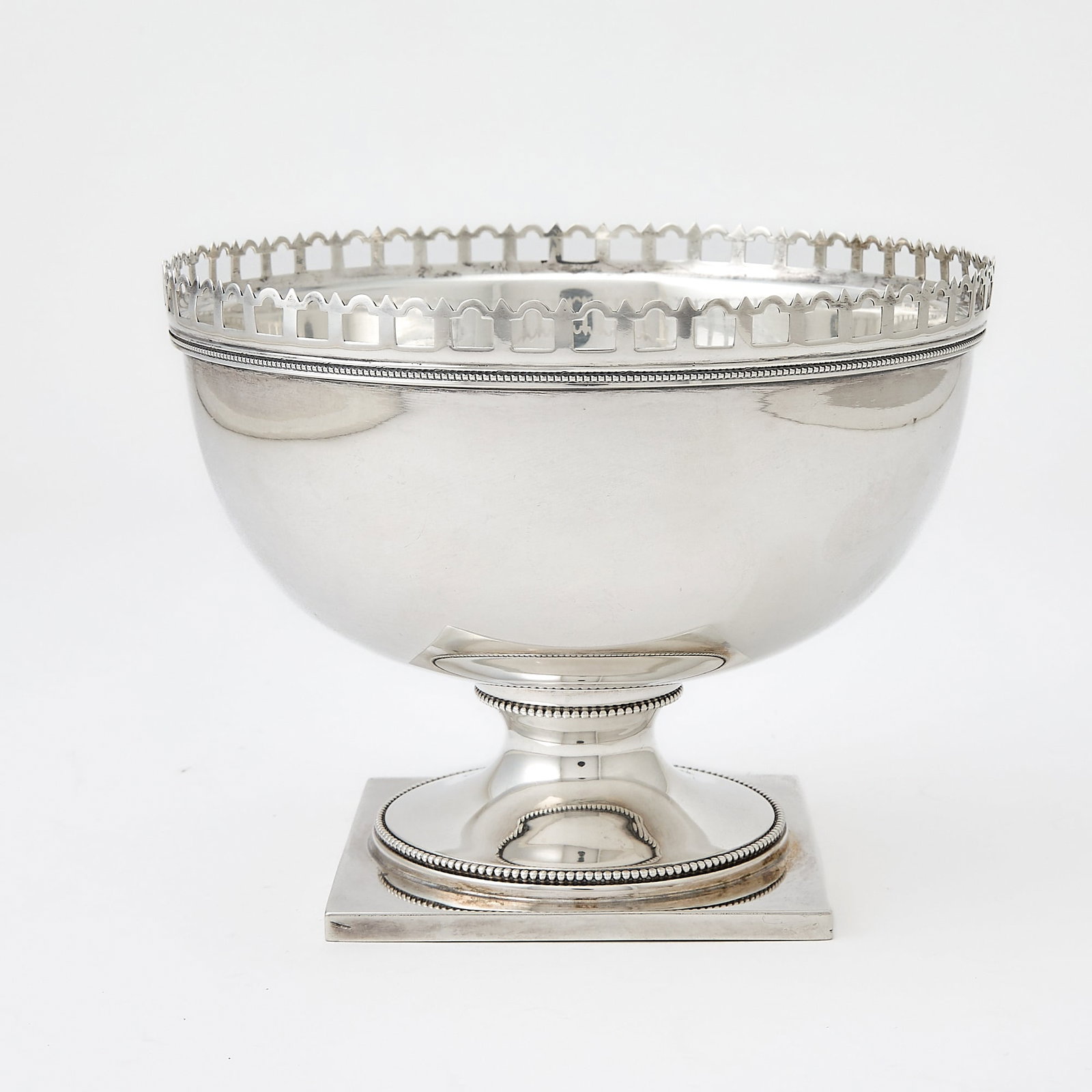 American Sterling Silver Bowl: Second quarter 20th century Circular with pierced rim, on a square foot. Height 5 1/4 inches, diameter 6 7/8 inches, approximately 14 ounces.