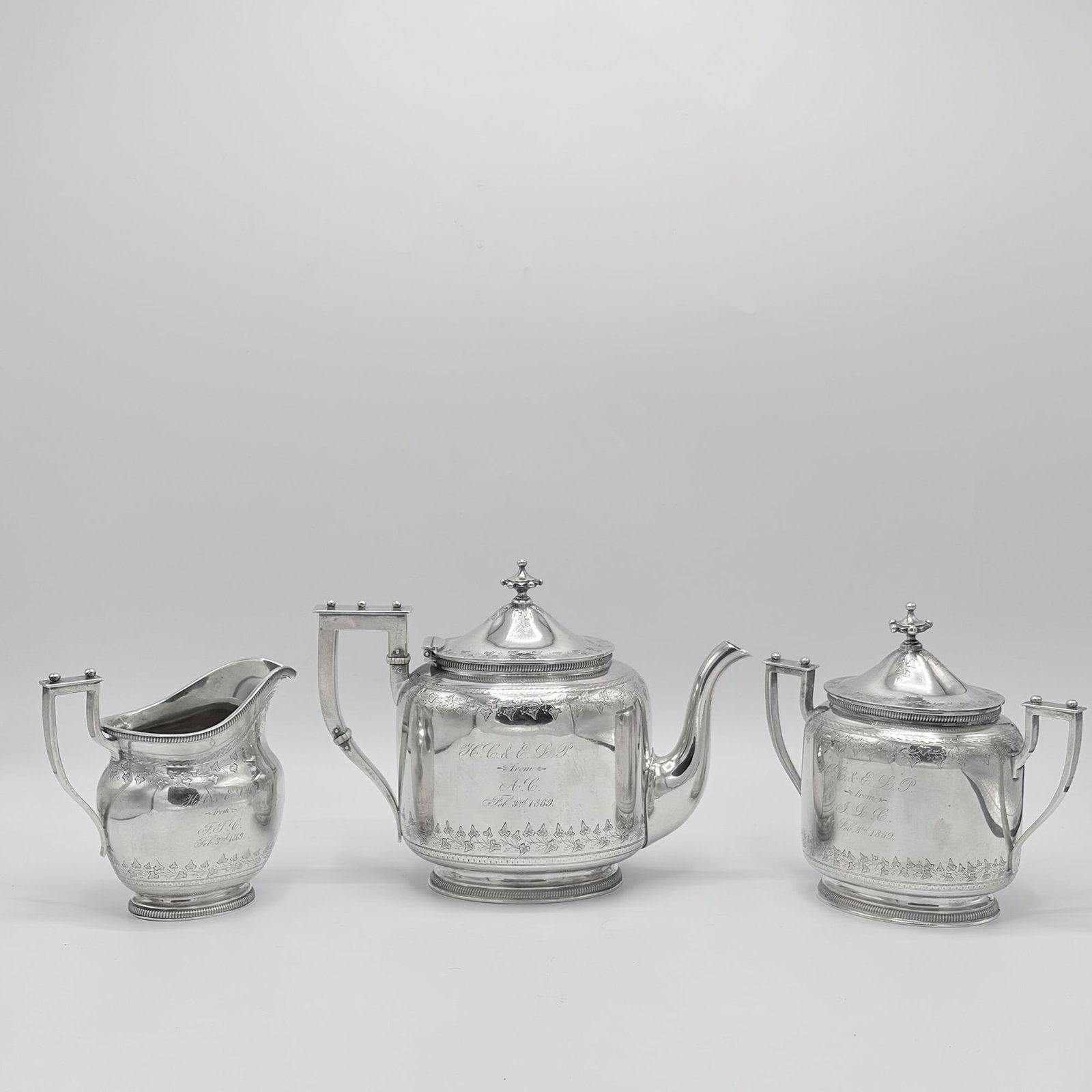 American Sterling Silver Three-Piece Tea Service: Shreve Stanwood & Co., Boston, Massachusetts, 1861-1869 Comprising a teapot, height 7 inches; covered sugar bowl; and a cream jug. Total approximately 52 ounces, all in.