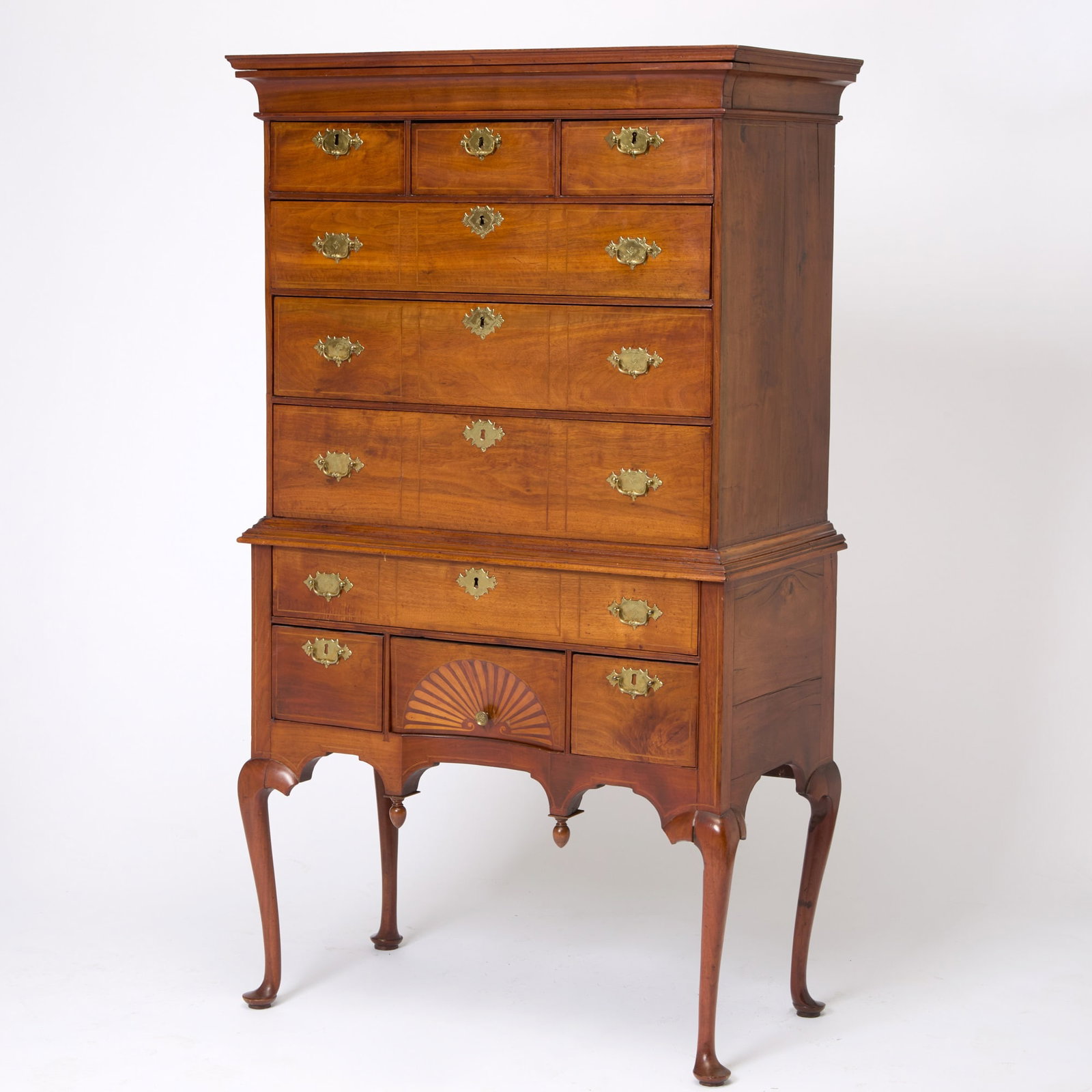 Queen Anne Inlaid Walnut High Chest of Drawers: Boston, Massachusetts, area, 1730-50 In two sections, the flat molded cornice with hidden drawer above cockbeaded case of three short and three long graduated drawers, on lower section with long