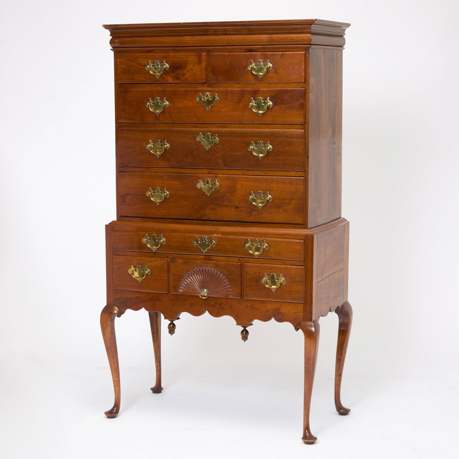 Queen Anne Walnut and Maple High Chest: Probably Salem, Massachusetts, circa 1770 The upper section with two thumbmolded short drawers above three graduated long drawers, on a lower section with long drawer and three short drawers, the