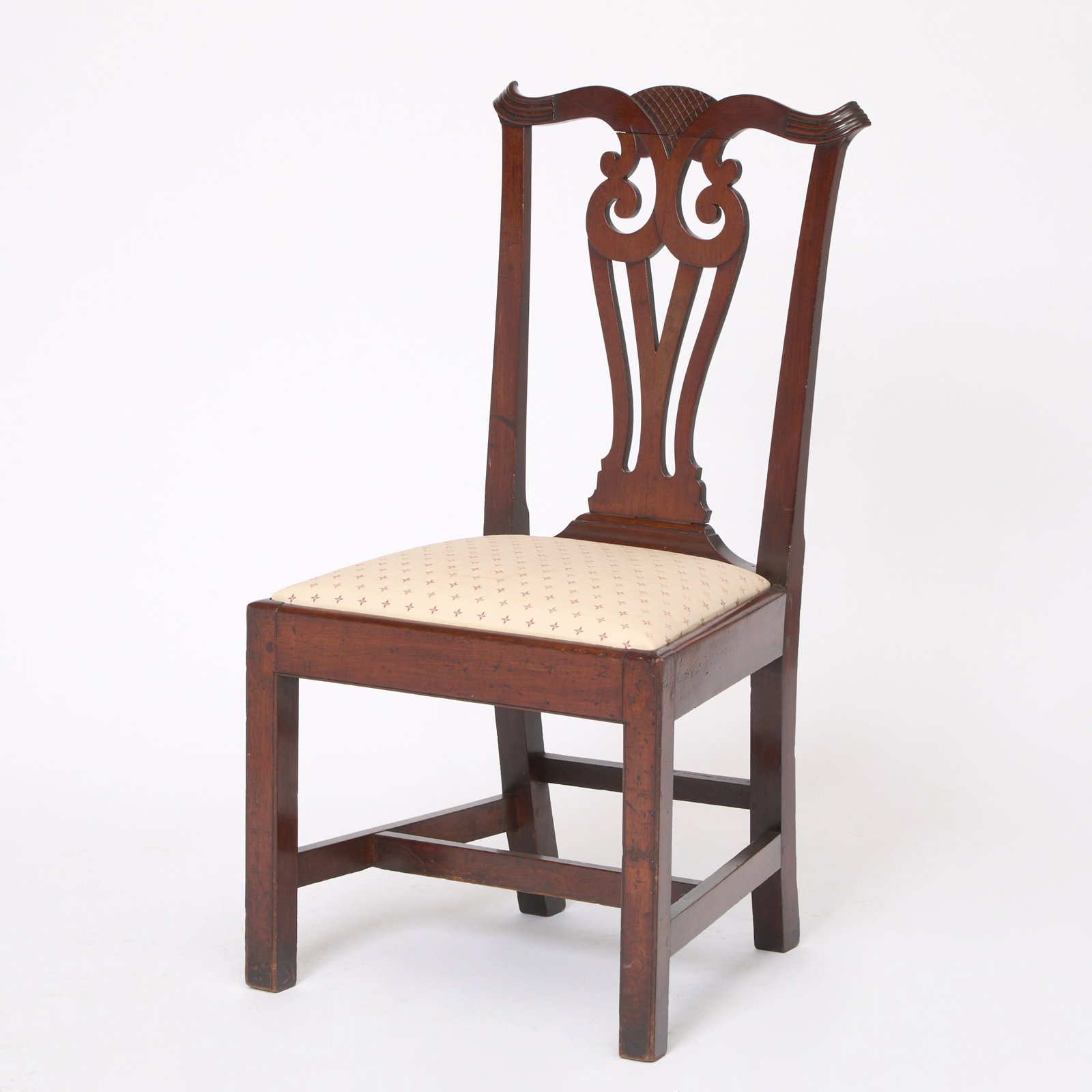 Chippendale Mahogany Side Chair: New Hampshire or Massachusetts, late 18th century The serpentine crestrail with reeded terminals centering a cross-hatched device above a pierced owl splat and trapezoidal slip seat, raised on beaded