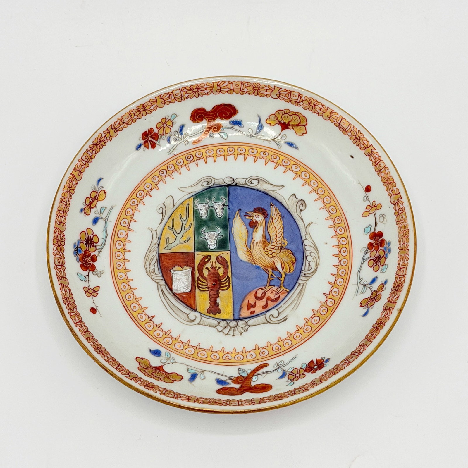 Chinese Export Porcelain Armorial Dutch Saucer: Mid-18th century Centering the Arms of Scholten, with floral border. Diameter 5 1/4 inches.