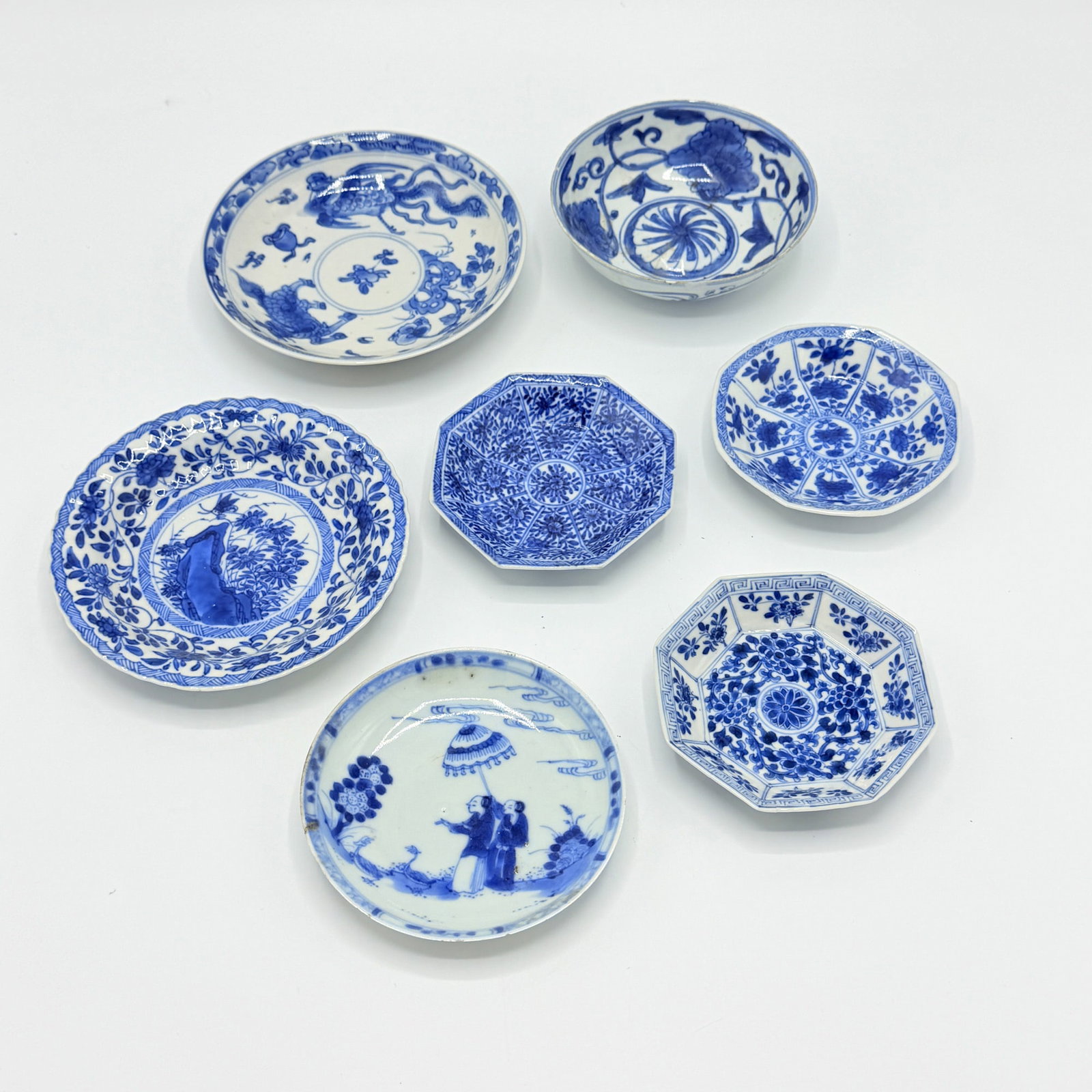 Group of Seven Small Chinese Blue and White Porcelain Dishes: 18th century Largest diameter 5 1/4 inches.