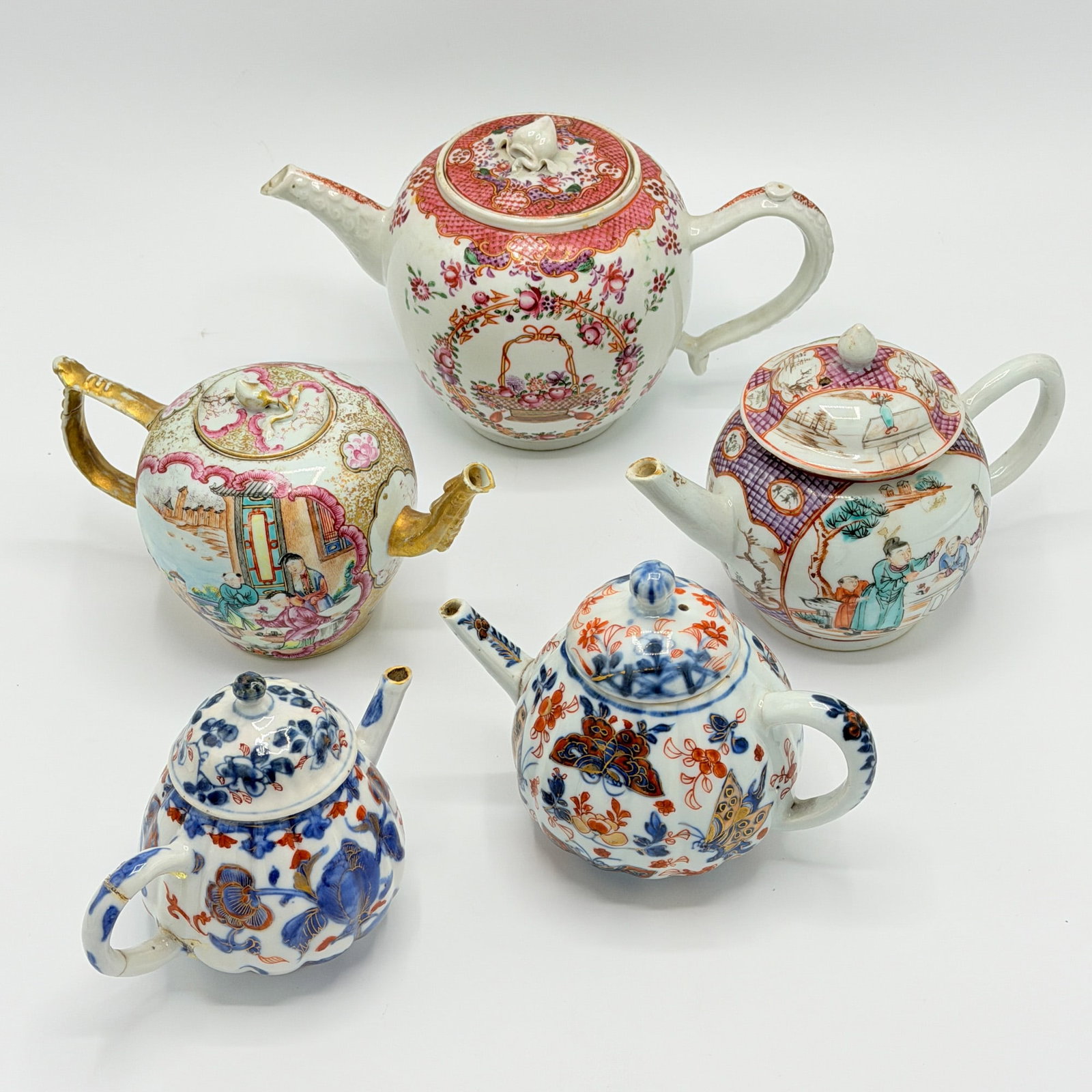 Group of Five Chinese Export Porcelain Teapots: Late 18th/early 19th century In Famille Rose and Imari palettes. Height of tallest 5 1/2 inches.