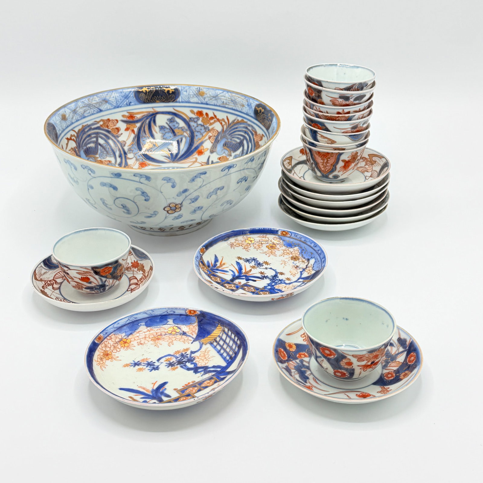 Group of Chinese Export Imari Palette Porcelain: Early 19th century Comprising ten assembled cups and saucers, and a punch bowl. Diameter of bowl 9 1/2 inches.