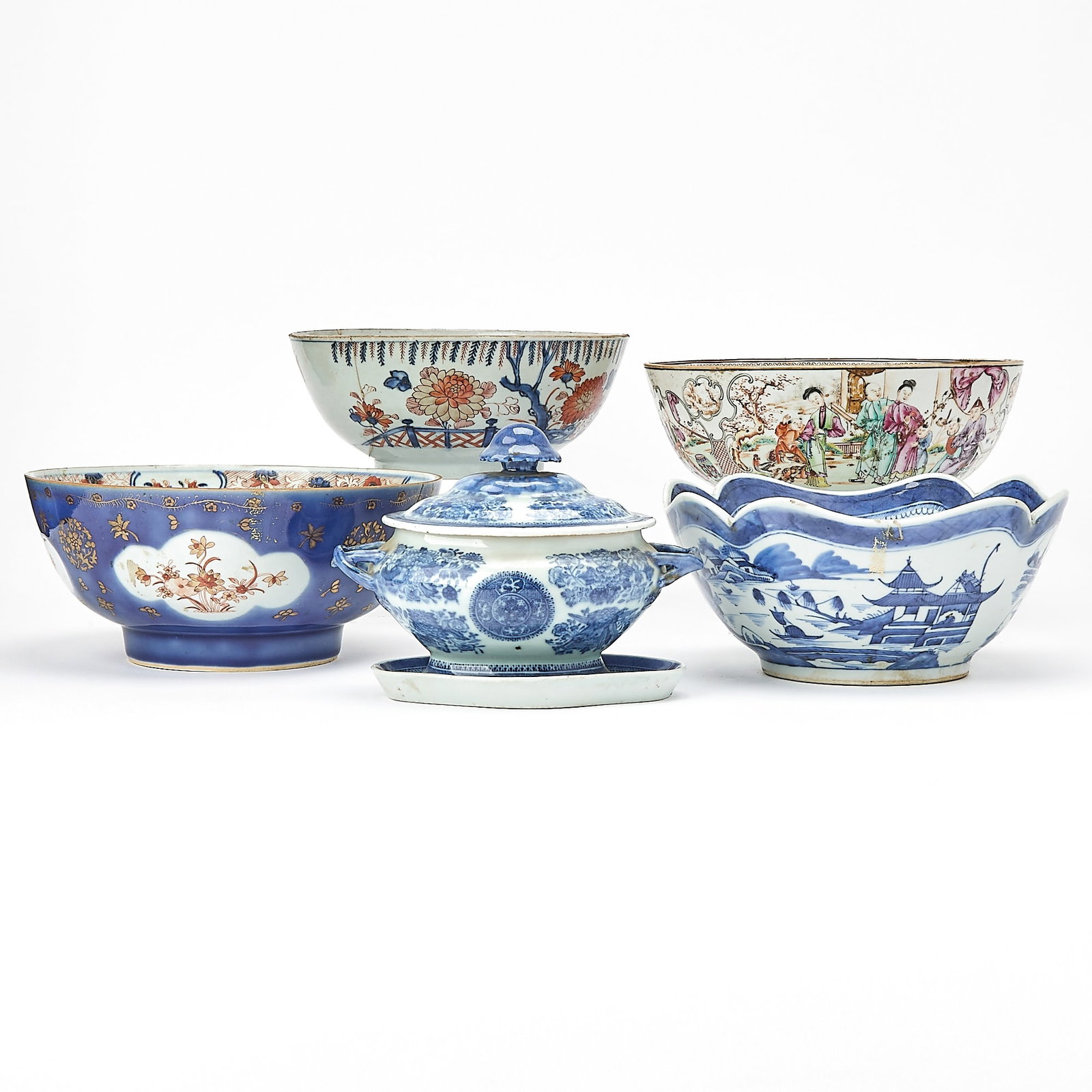 Group of Four Chinese Export Porcelain Bowls and a Tureen: 18th and 19th century Comprising a Canton pattern cut corner bowl; a figural punch bowl; two Imari palette punch bowls, one with blue enameled exterior; and a blue Fitz Hugh pattern sauce tureen and s