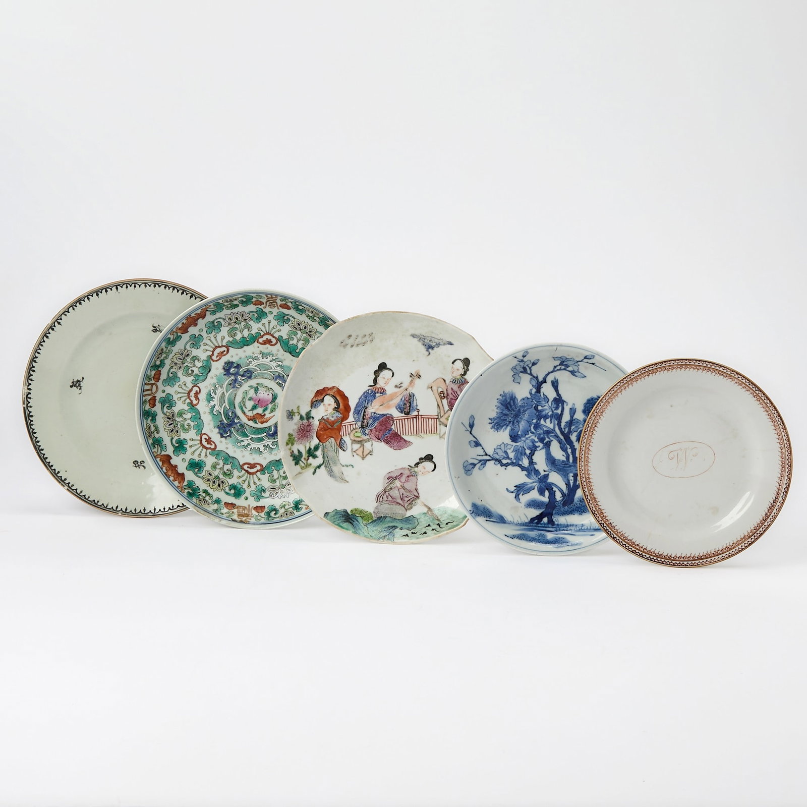 Group of Five Small Chinese Export Porcelain Dishes: 18th and early 19th century Including a figural plate with cut corners, a blue and white plate with tree and pheasant, a plate centering the initial "W" within an oval, a famille rose plate centering 